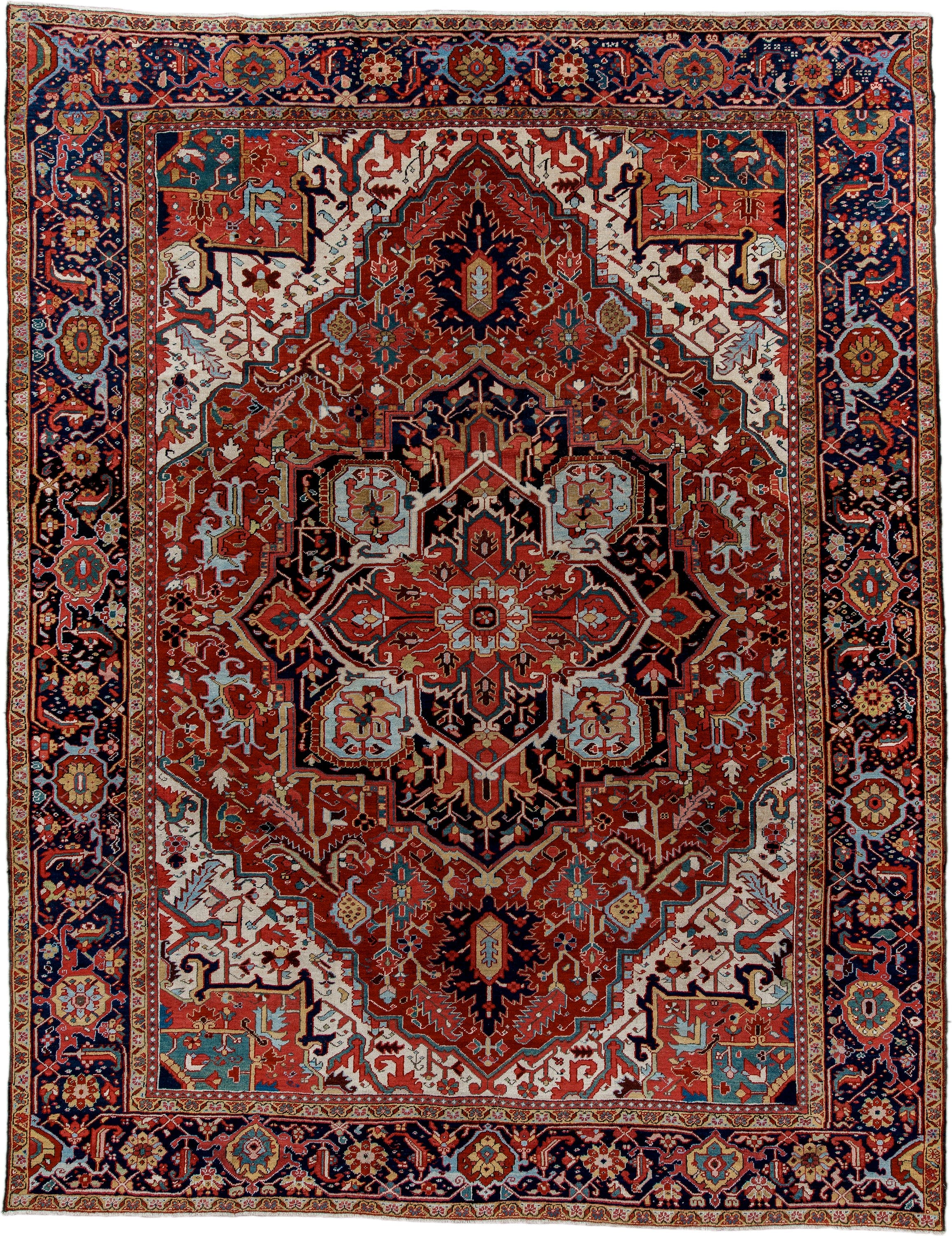 9' x 12' one-of-a-kind handmade antique Heriz large size rug. Color palette: rust, navy, ivory, sky blue, soft gold, coral