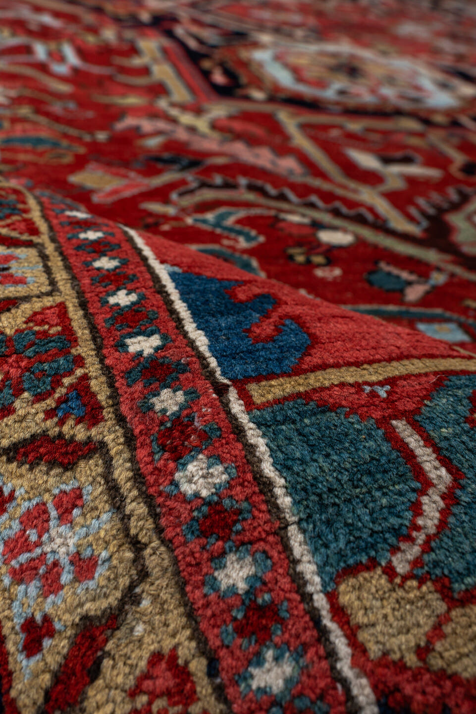 9' x 12' one-of-a-kind handmade antique Heriz large size rug. Color palette: rust, navy, ivory, sky blue, soft gold, coral