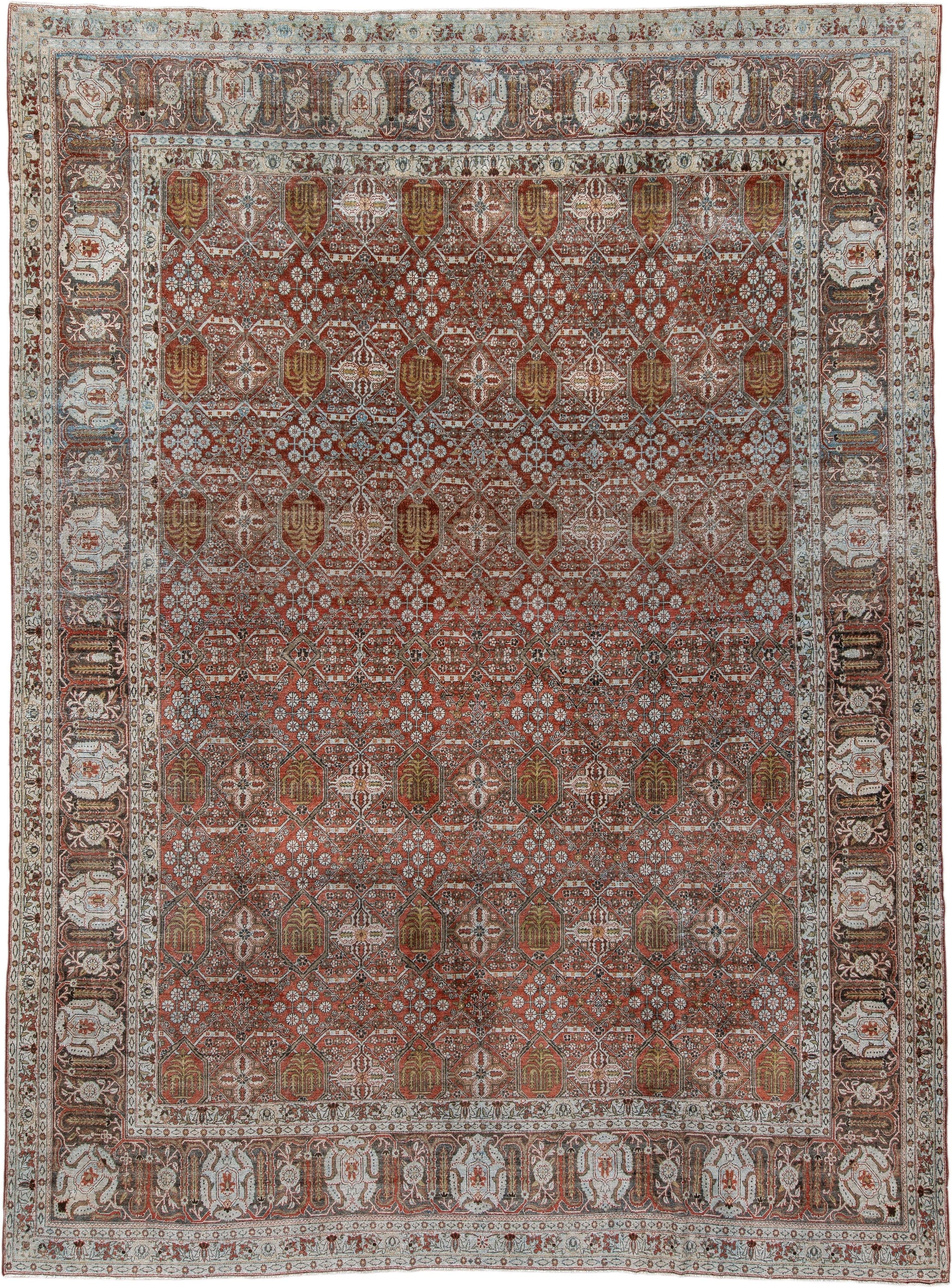 8' x 11' one-of-a-kind handmade antique Joshegan large size rug. Color palette: rust, ivory, slate, brown, gold, camel