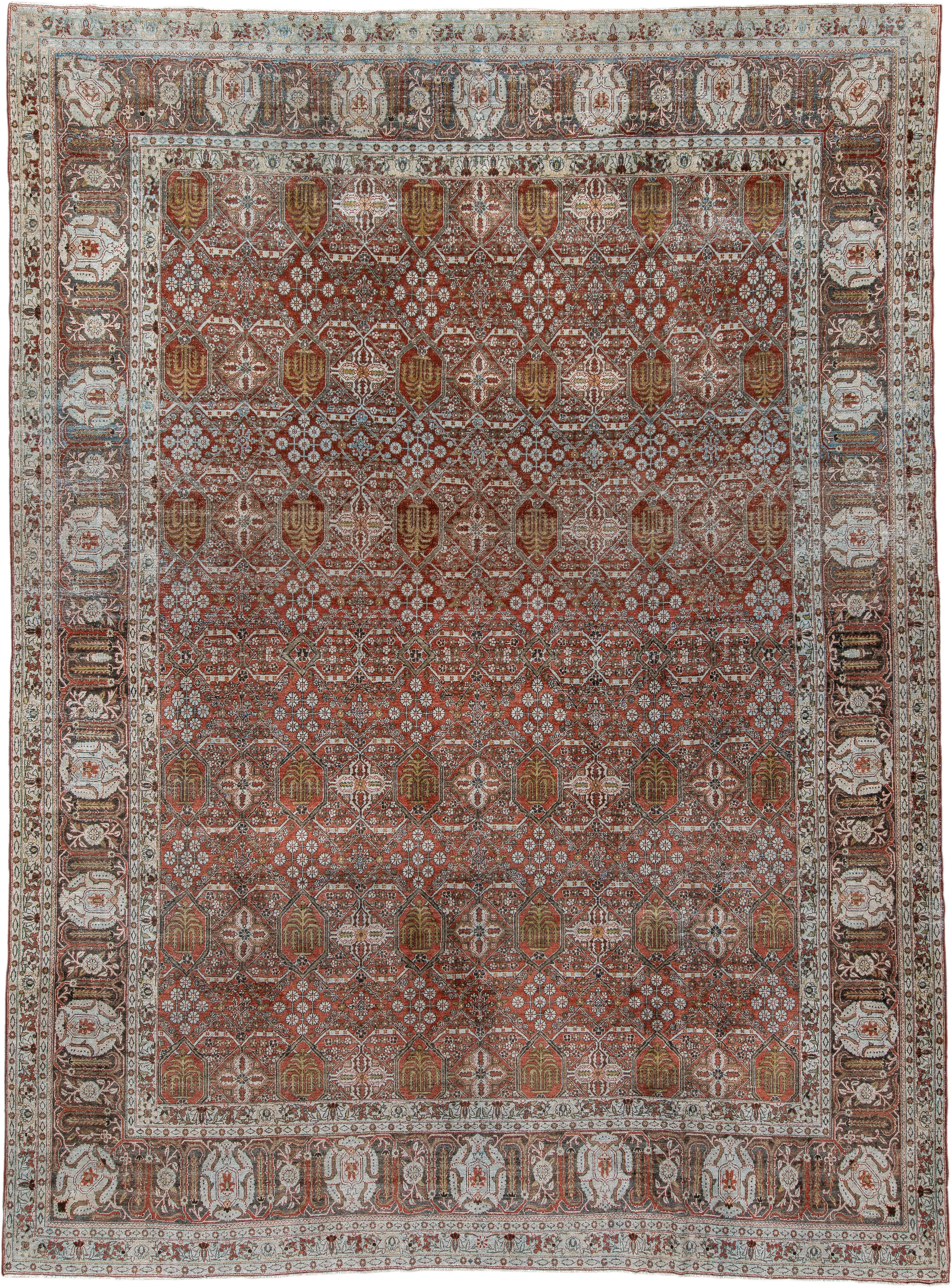 8' x 11' one-of-a-kind handmade antique Joshegan large size rug. Color palette: rust, ivory, slate, brown, gold, camel