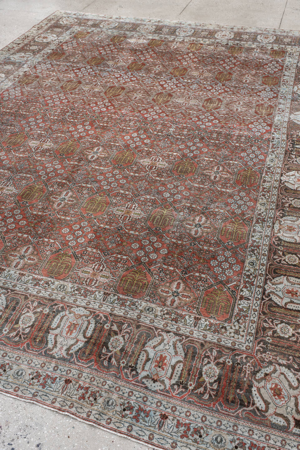 8' x 11' one-of-a-kind handmade antique Joshegan large size rug. Color palette: rust, ivory, slate, brown, gold, camel