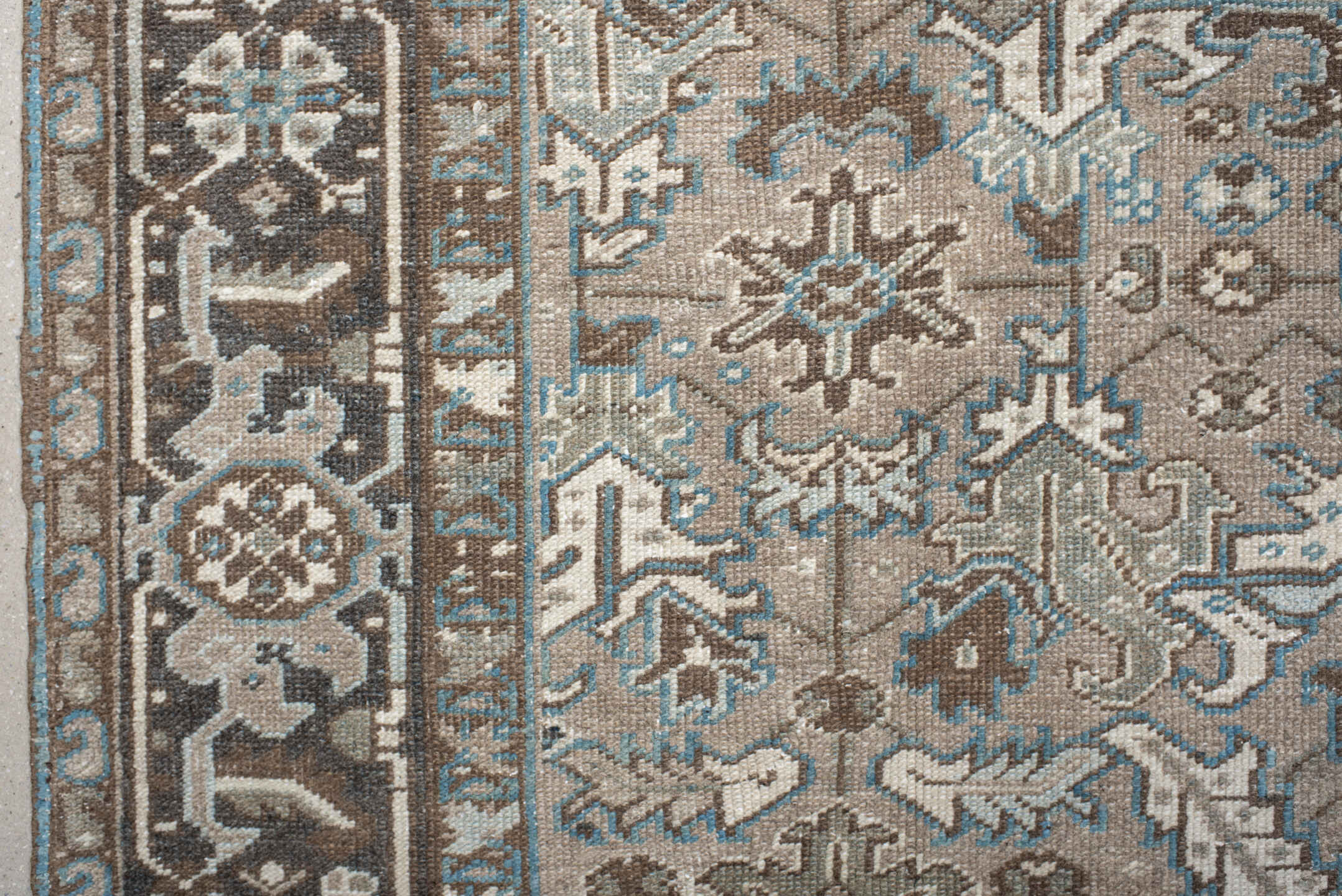 6' x 7' one-of-a-kind handmade antique Heriz rug. Color palette: taupe, brown, ivory, sky blue, charcoal, camel, beige, gray