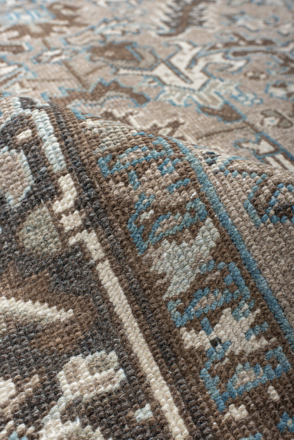 6' x 7' one-of-a-kind handmade antique Heriz rug. Color palette: taupe, brown, ivory, sky blue, charcoal, camel, beige, gray