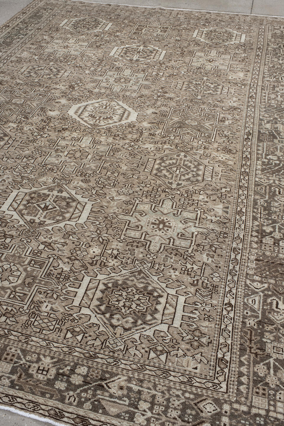 7' x 10' one-of-a-kind handmade vintage Karaje large size rug. Color palette: taupe, ivory, brown, rose, camel, charcoal