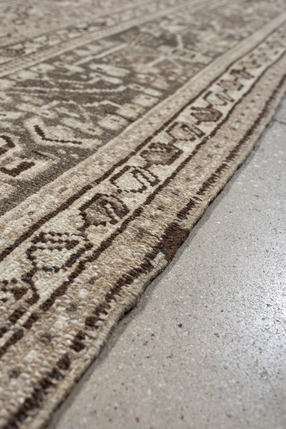 7' x 10' one-of-a-kind handmade vintage Karaje large size rug. Color palette: taupe, ivory, brown, rose, camel, charcoal