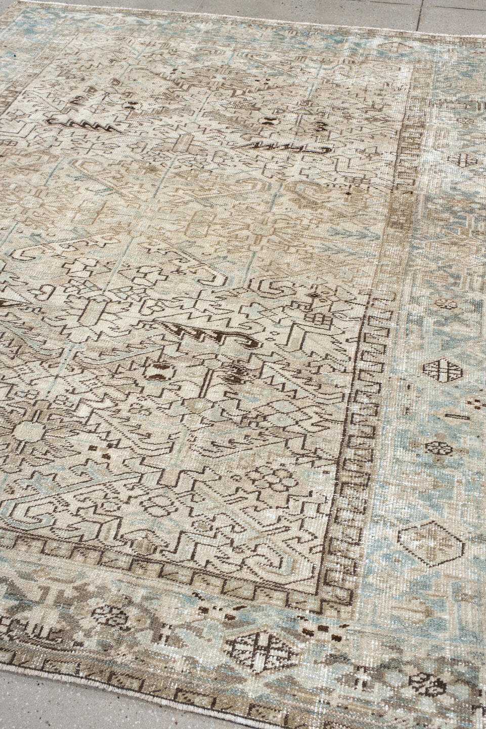 7' x 8' one-of-a-kind handmade antique Heriz rug. Color palette: ivory, pale blue, taupe, brown, cream, light blue, beige