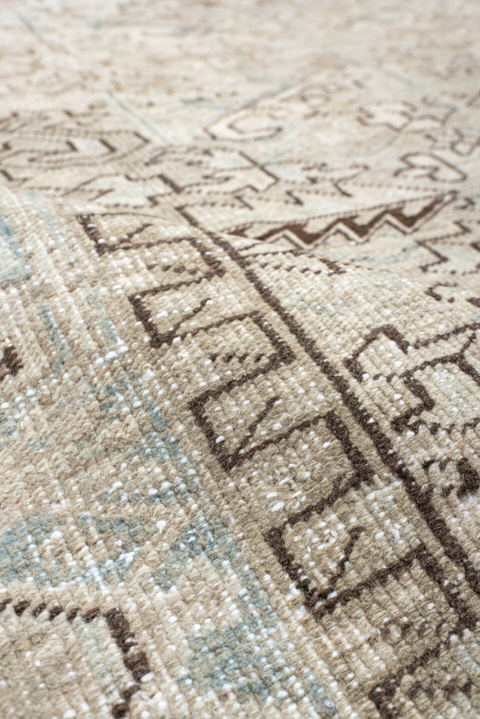 7' x 8' one-of-a-kind handmade antique Heriz rug. Color palette: ivory, pale blue, taupe, brown, cream, light blue, beige