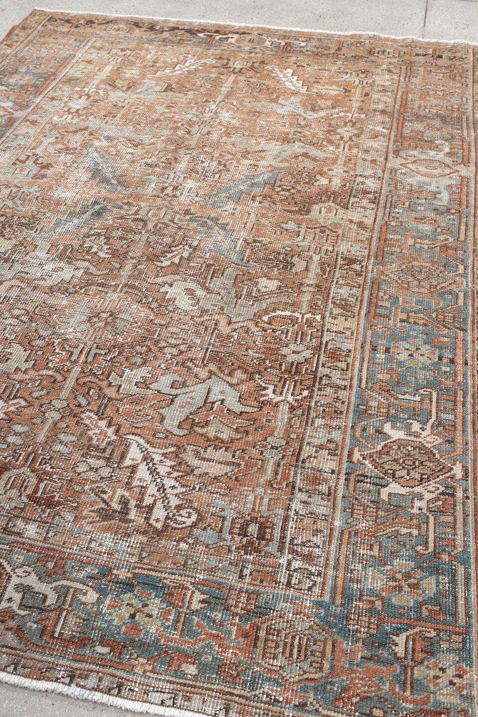 6' x 8' one-of-a-kind handmade antique Heriz medium size rug. Color palette: terra cotta, ivory, soft blue, taupe, rust