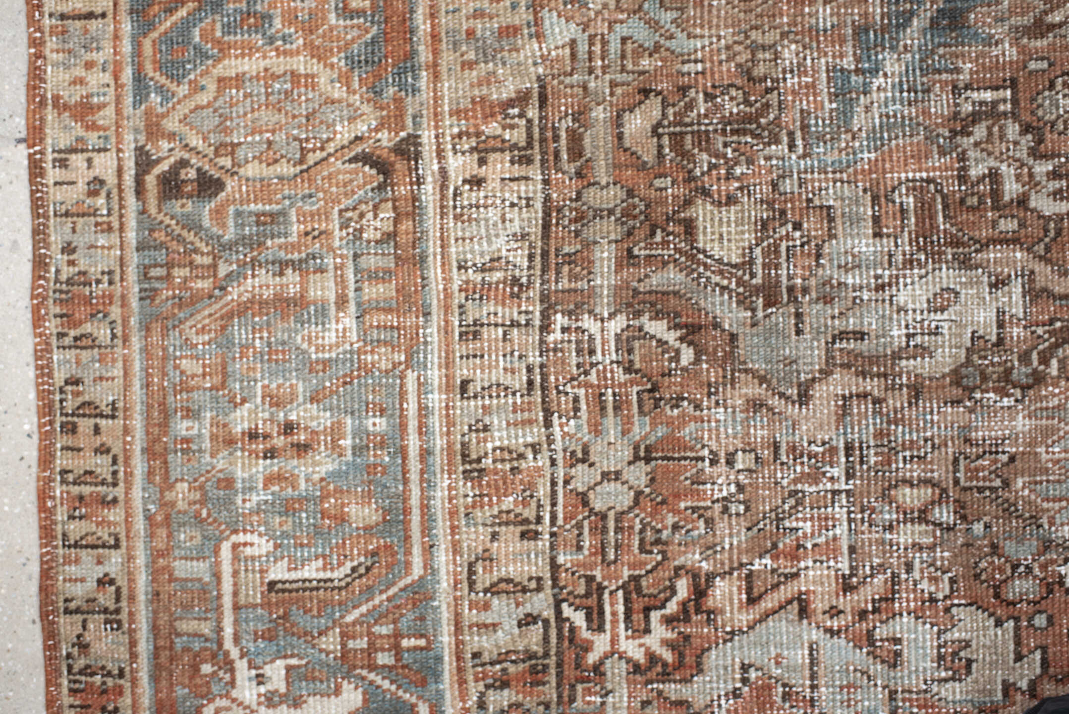 6' x 8' one-of-a-kind handmade antique Heriz medium size rug. Color palette: terra cotta, ivory, soft blue, taupe, rust