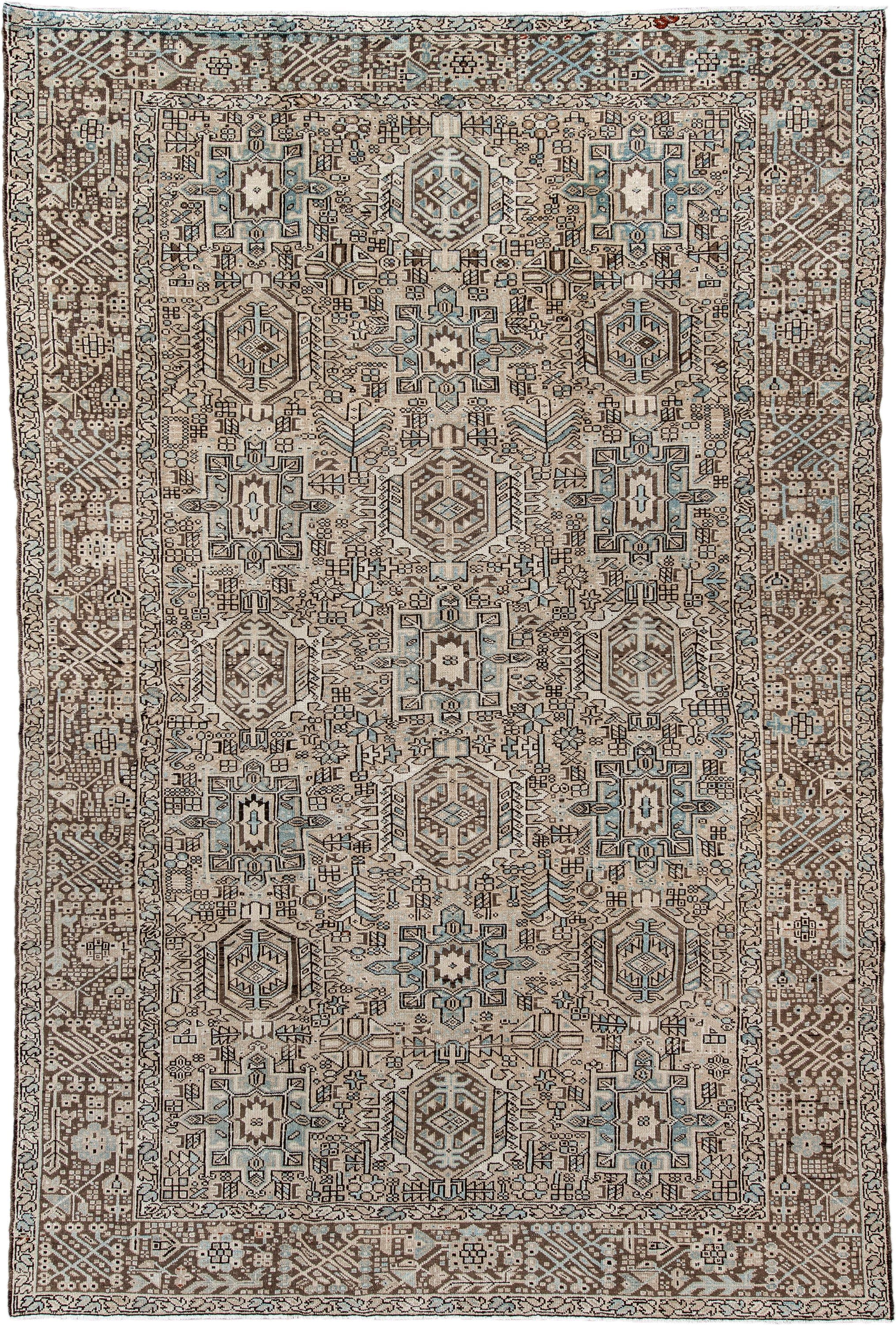7' x 11' one-of-a-kind handmade antique Karaje large size rug. Color palette: ivory, brown, sky blue, taupe, camel