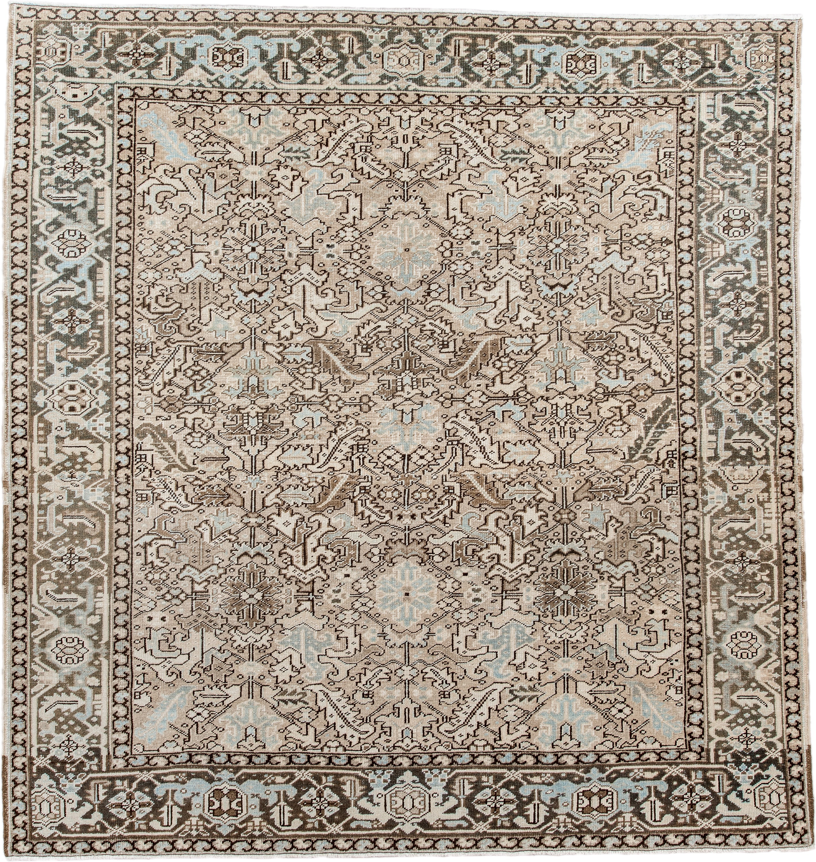 7' x 8' one-of-a-kind handmade antique Heriz rug. Color palette: ivory, taupe, brown, camel, pale blue, charcoal, beige