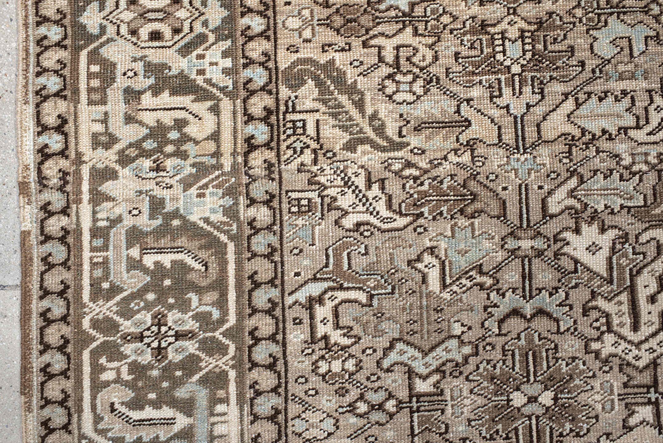 7' x 8' one-of-a-kind handmade antique Heriz rug. Color palette: ivory, taupe, brown, camel, pale blue, charcoal, beige