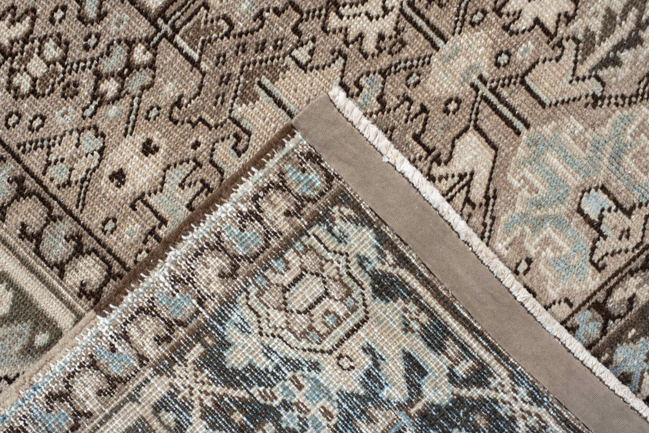 7' x 8' one-of-a-kind handmade antique Heriz rug. Color palette: ivory, taupe, brown, camel, pale blue, charcoal, beige