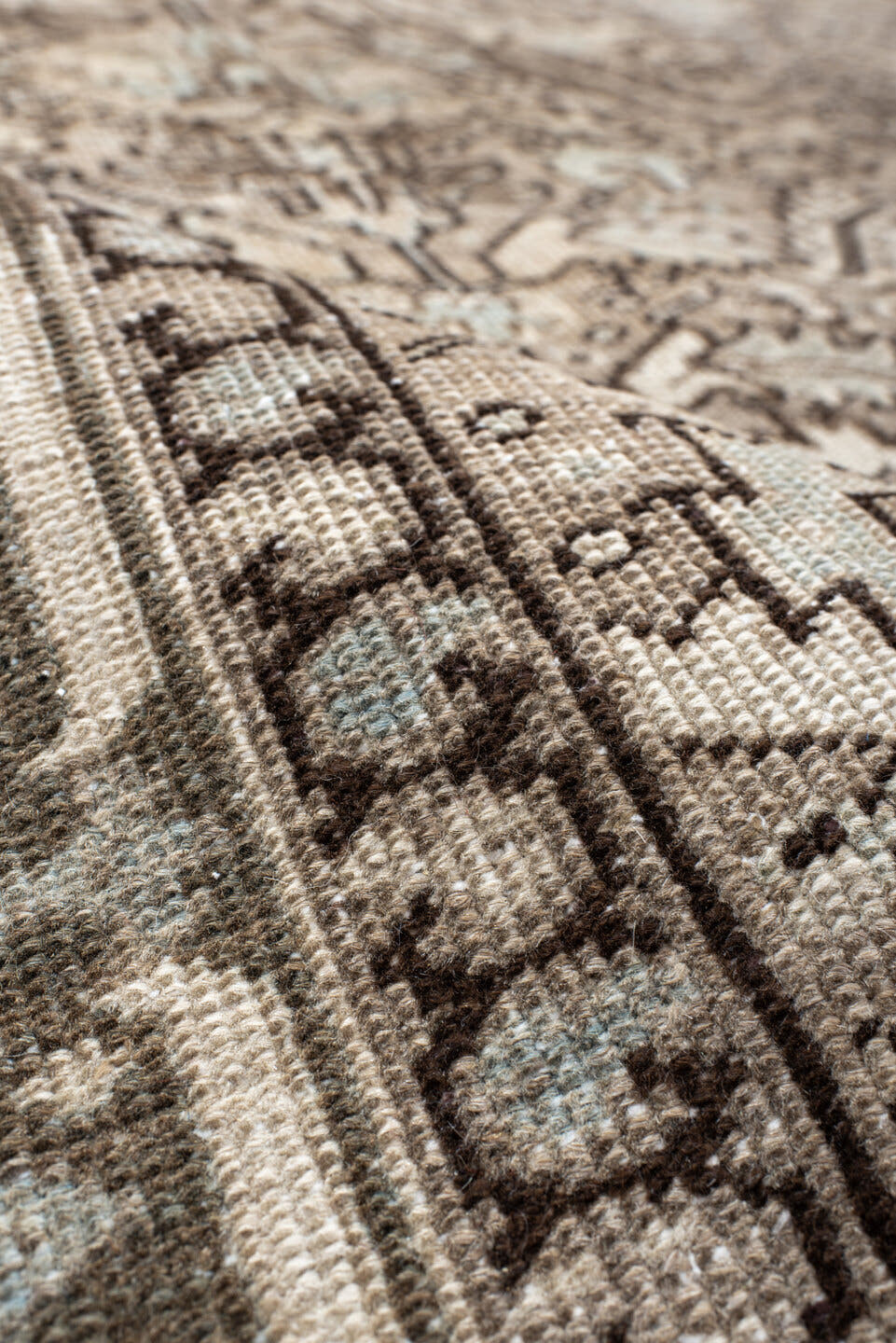7' x 8' one-of-a-kind handmade antique Heriz rug. Color palette: ivory, taupe, brown, camel, pale blue, charcoal, beige