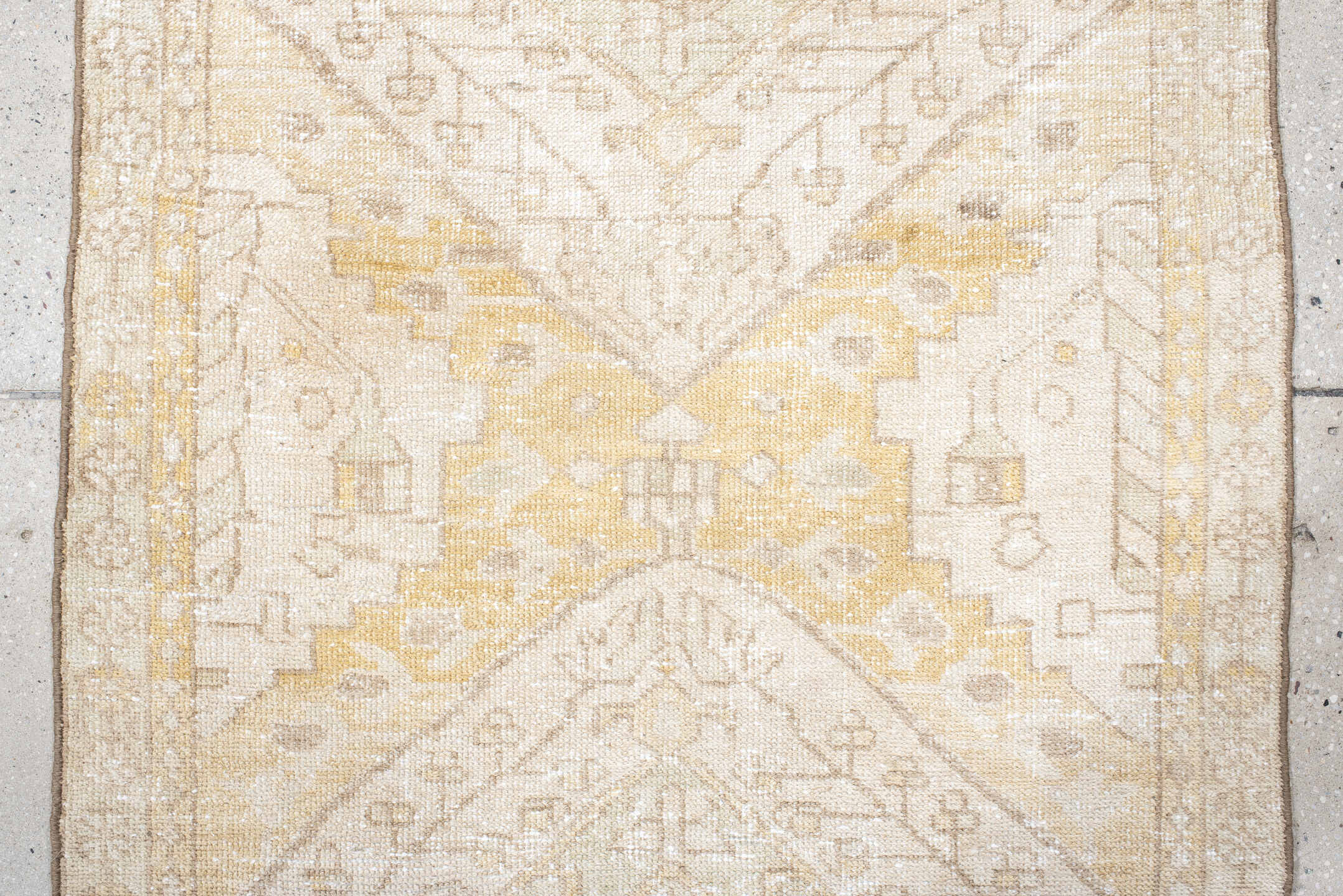 2' x 10' one-of-a-kind handmade vintage Karaje runner rug. Color palette: ivory, sand, cream, pale gold, taupe, sage, beige