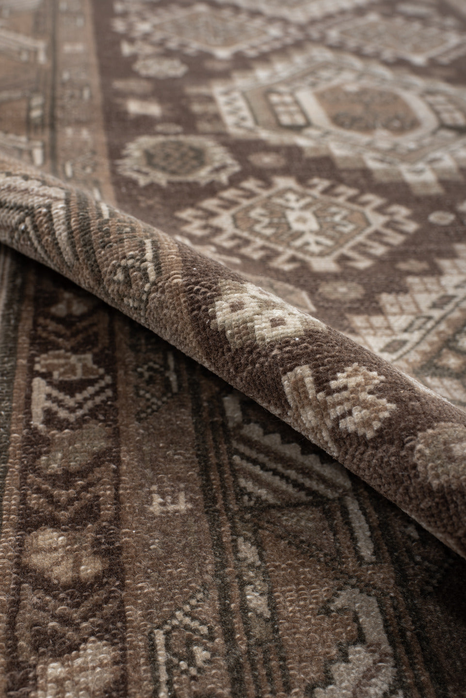 2' x 10' one-of-a-kind handmade vintage Sivas runner rug. Color palette: brown, gray, light gray, off-white, pink