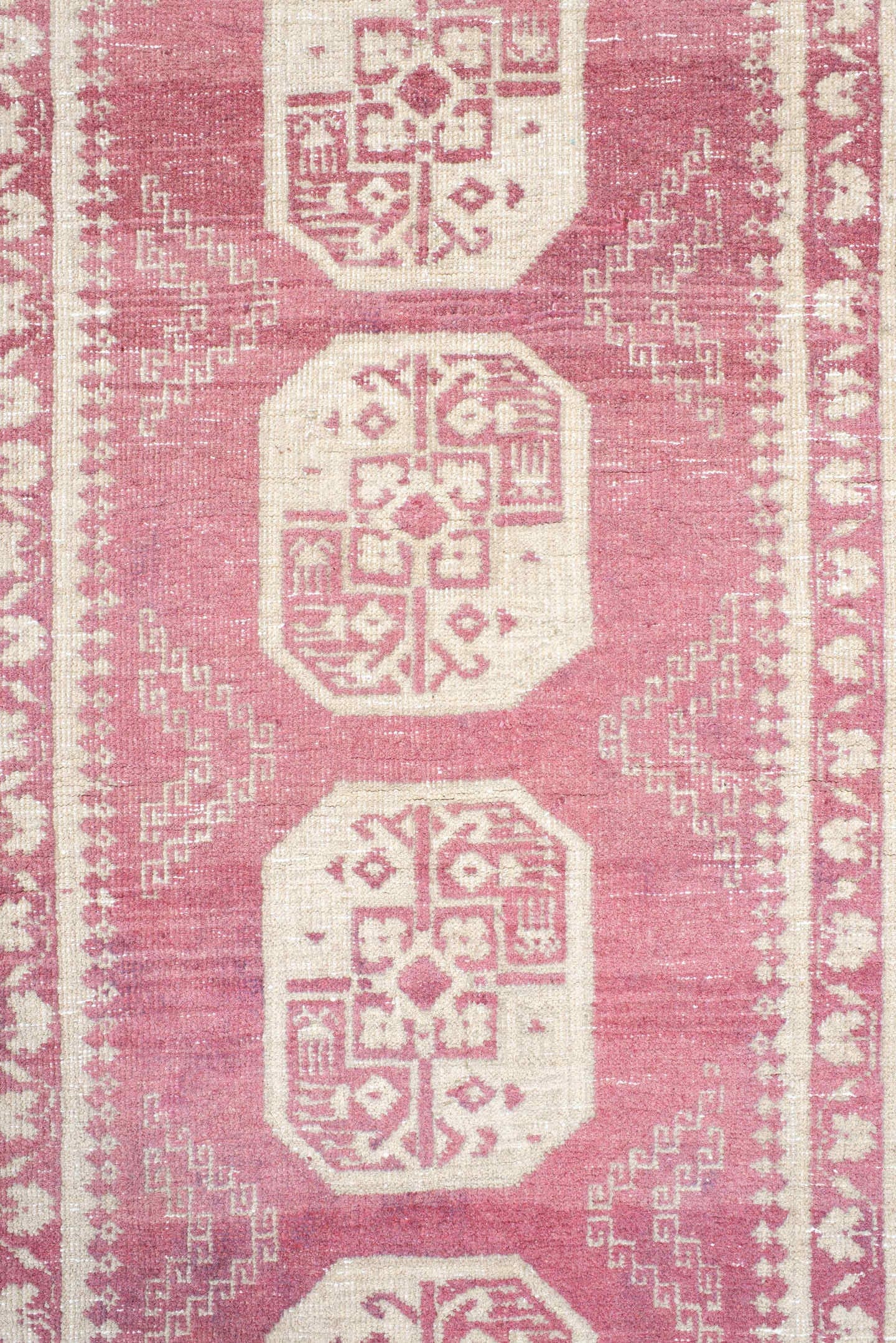 3' x 10' one-of-a-kind handmade vintage Afghan runner rug. Color palette: rose, ivory, dusty pink, burgundy, pink, red