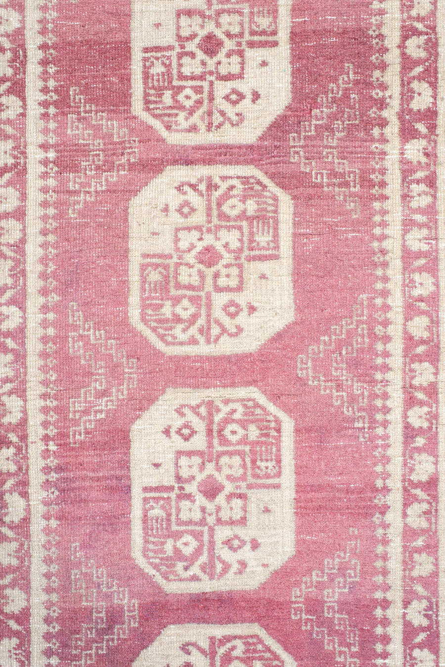 3' x 10' one-of-a-kind handmade vintage Afghan runner rug. Color palette: rose, ivory, dusty pink, burgundy, pink, red