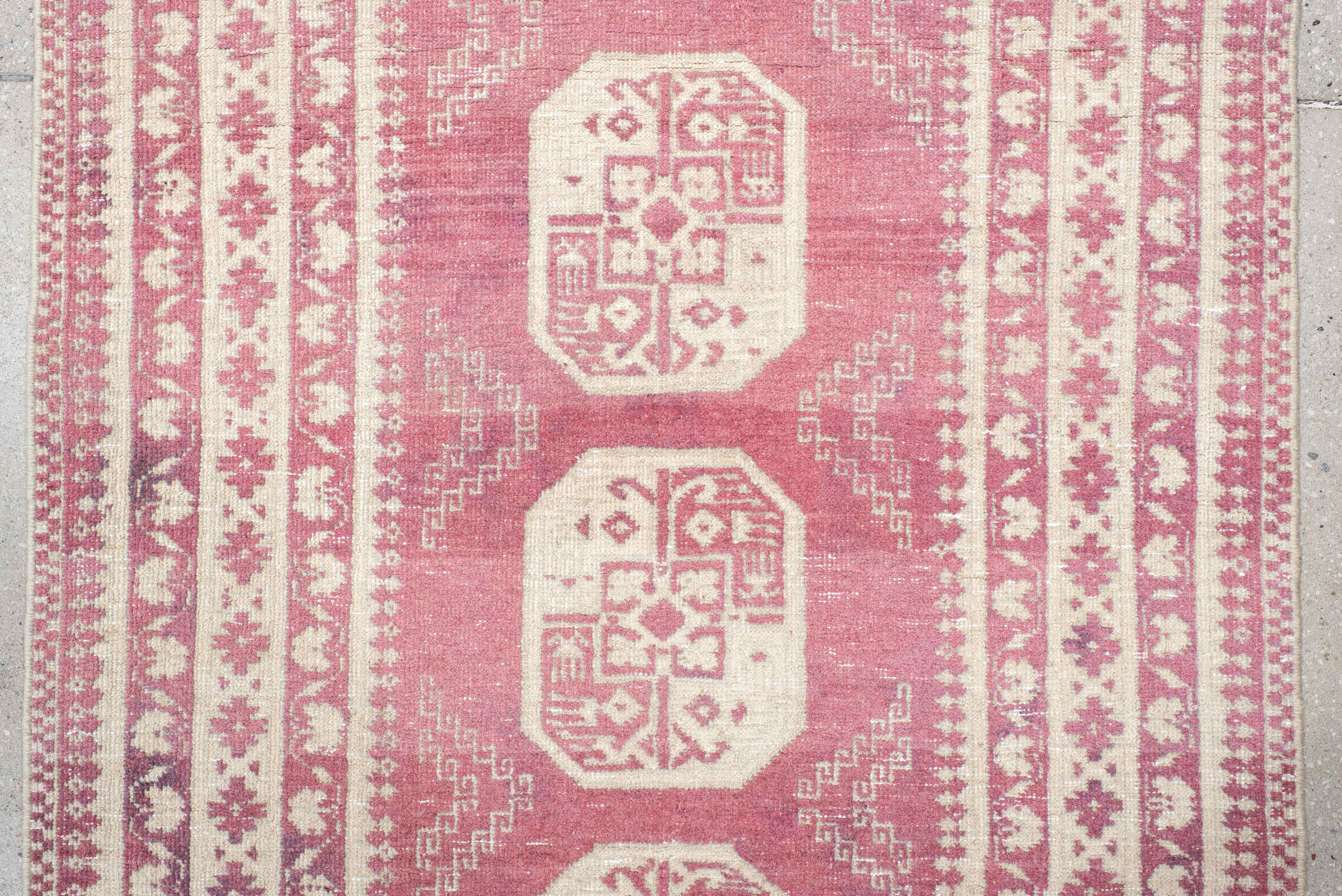 3' x 10' one-of-a-kind handmade vintage Afghan runner rug. Color palette: rose, ivory, dusty pink, burgundy, pink, red