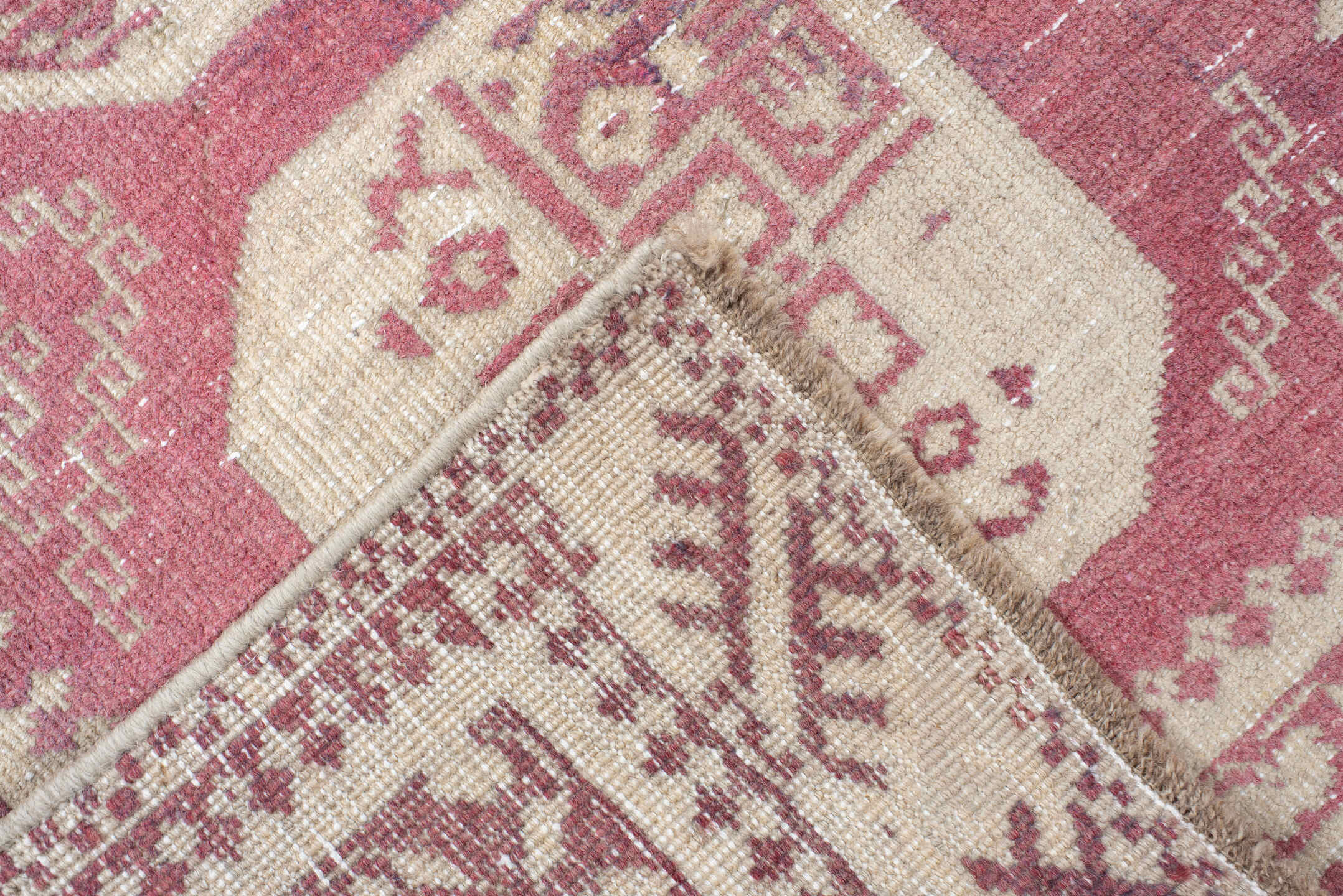 3' x 10' one-of-a-kind handmade vintage Afghan runner rug. Color palette: rose, ivory, dusty pink, burgundy, pink, red