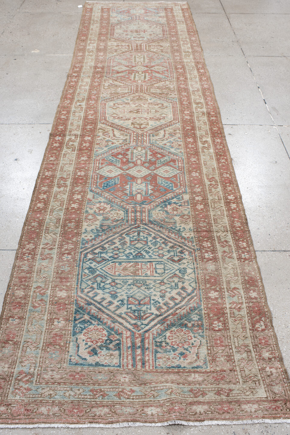 3' x 12' one-of-a-kind handmade vintage NW Persian runner rug. Color palette: ivory, rust, pale blue, taupe, camel