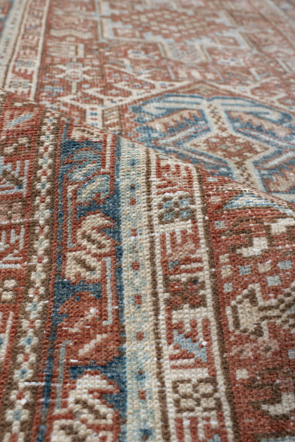 3' x 11' one-of-a-kind handmade antique Karaje runner rug. Color palette: terra cotta, ivory, sky blue, rust, camel, slate