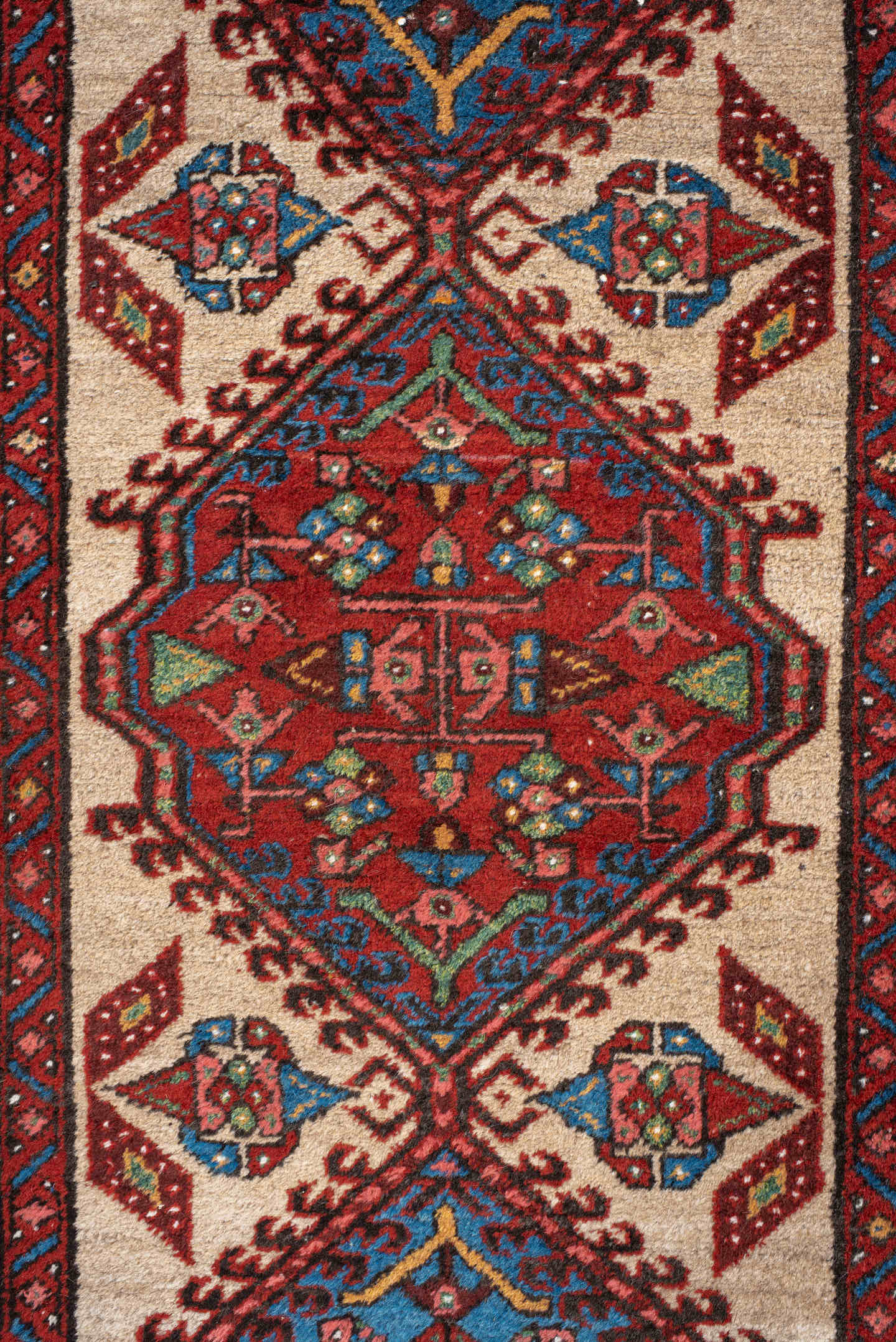 3' x 10' one-of-a-kind handmade antique Sarab runner rug. Color palette: ivory, rust, sky blue, crimson, navy, teal, brown