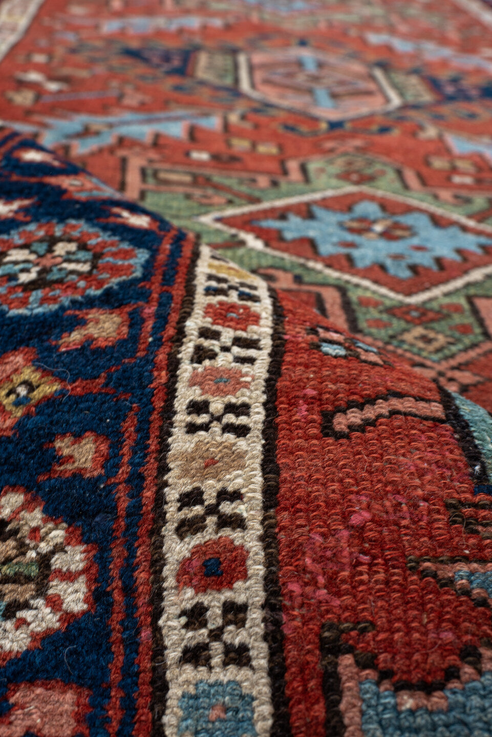 3' x 12' one-of-a-kind handmade antique Karaje runner rug. Color palette: rust, navy, ivory, sky_blue, sage, camel