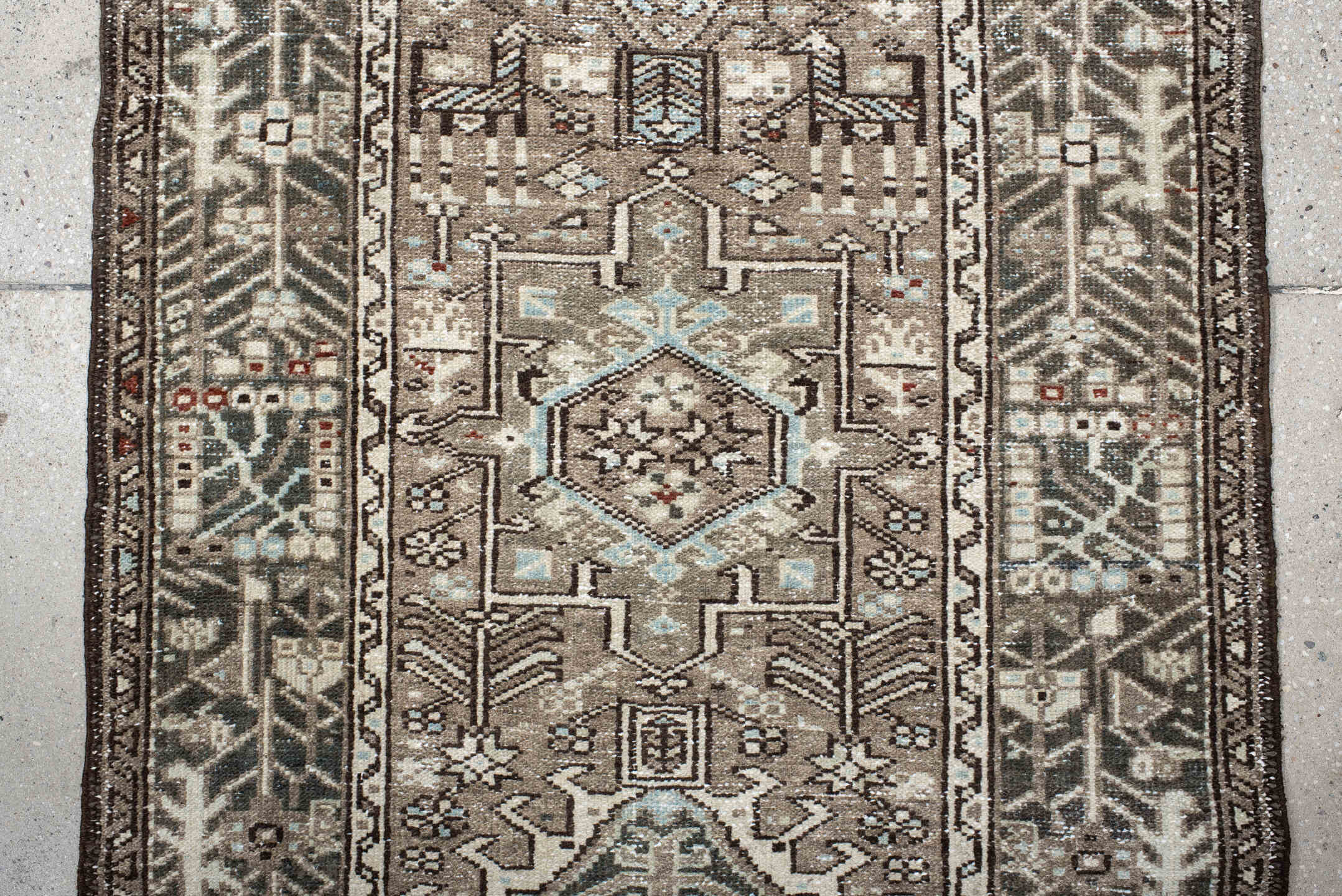 2' x 10' one-of-a-kind handmade vintage Karaje runner rug. Color palette: taupe, charcoal, ivory, pale blue, rust, brown