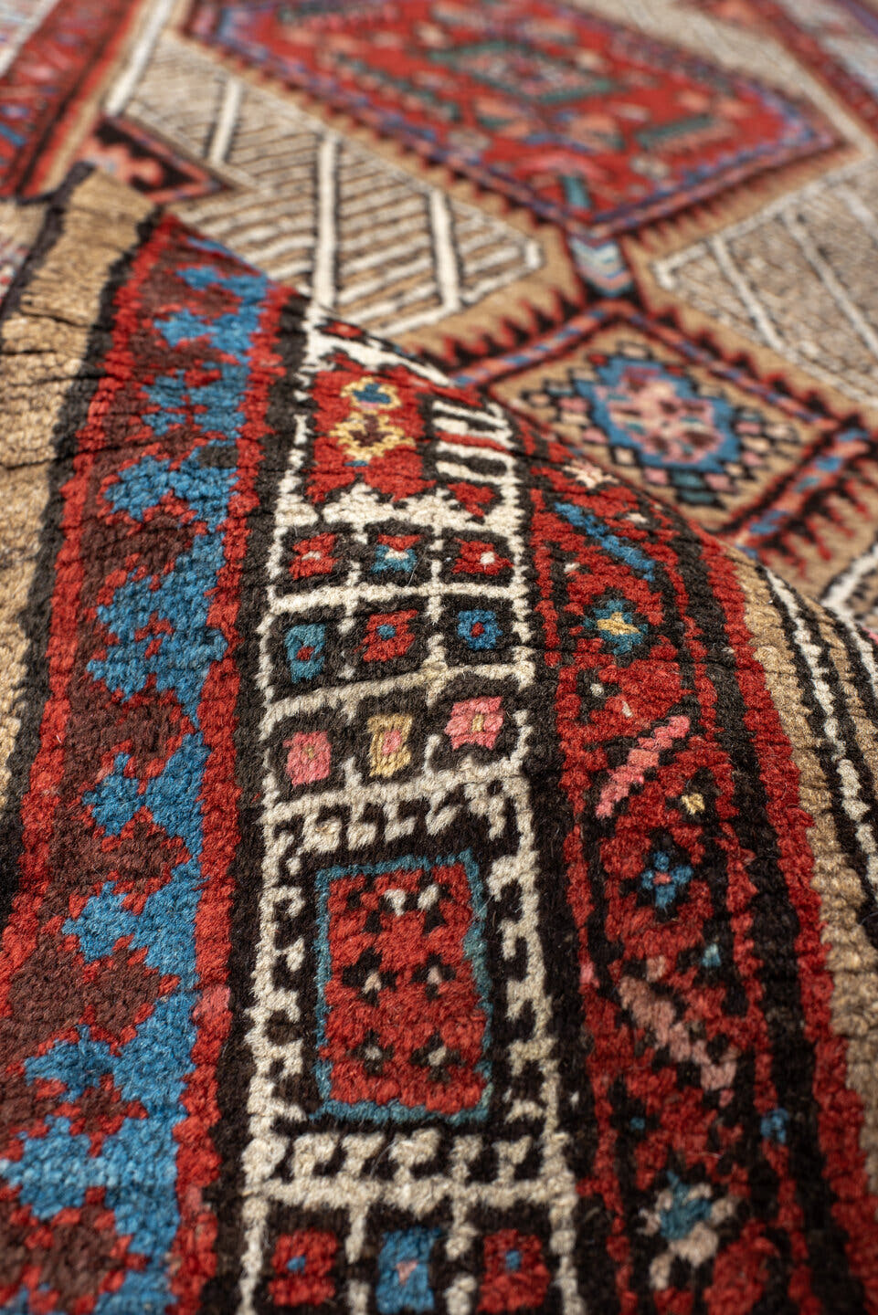 2' x 8' one-of-a-kind handmade antique Sarab runner rug. Color palette: ivory, rust, indigo, camel, rose, charcoal, sky_blue