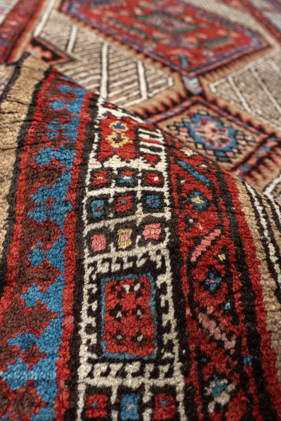 2' x 8' one-of-a-kind handmade antique Sarab runner rug. Color palette: ivory, rust, indigo, camel, rose, charcoal, sky_blue
