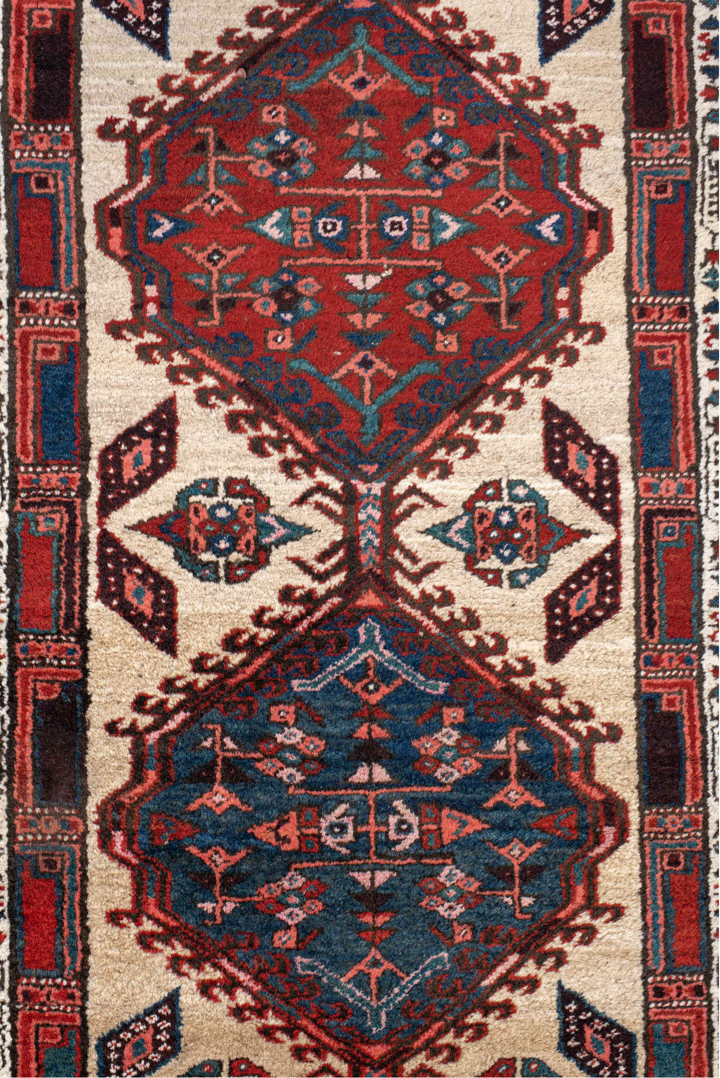 3' x 11' one-of-a-kind handmade antique Sarab runner rug. Color palette: ivory, rust, indigo, navy, crimson, charcoal