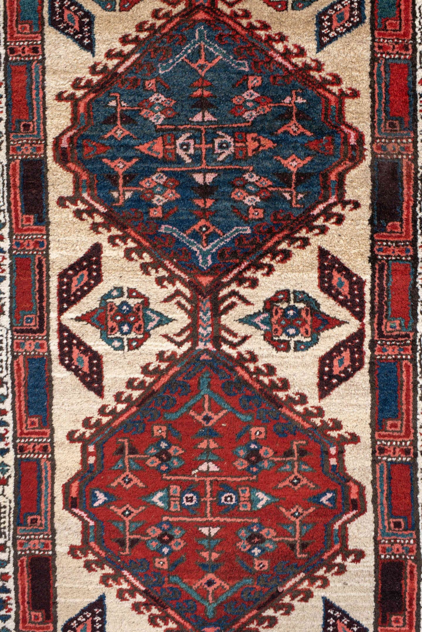 3' x 11' one-of-a-kind handmade antique Sarab runner rug. Color palette: ivory, rust, indigo, navy, crimson, charcoal