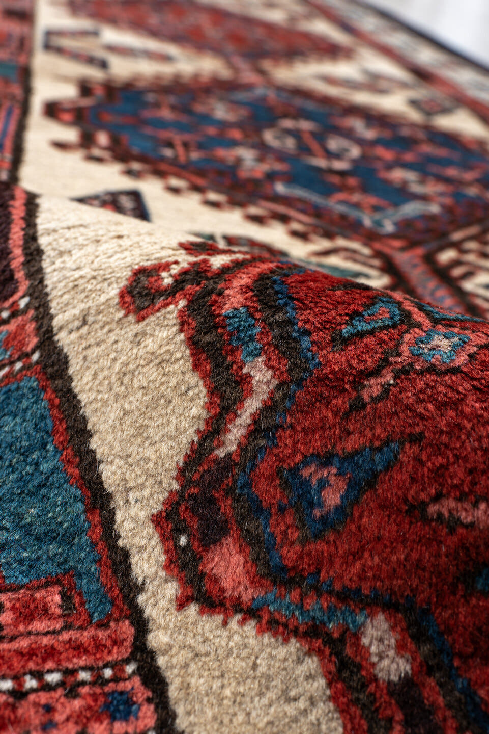 3' x 11' one-of-a-kind handmade antique Sarab runner rug. Color palette: ivory, rust, indigo, navy, crimson, charcoal