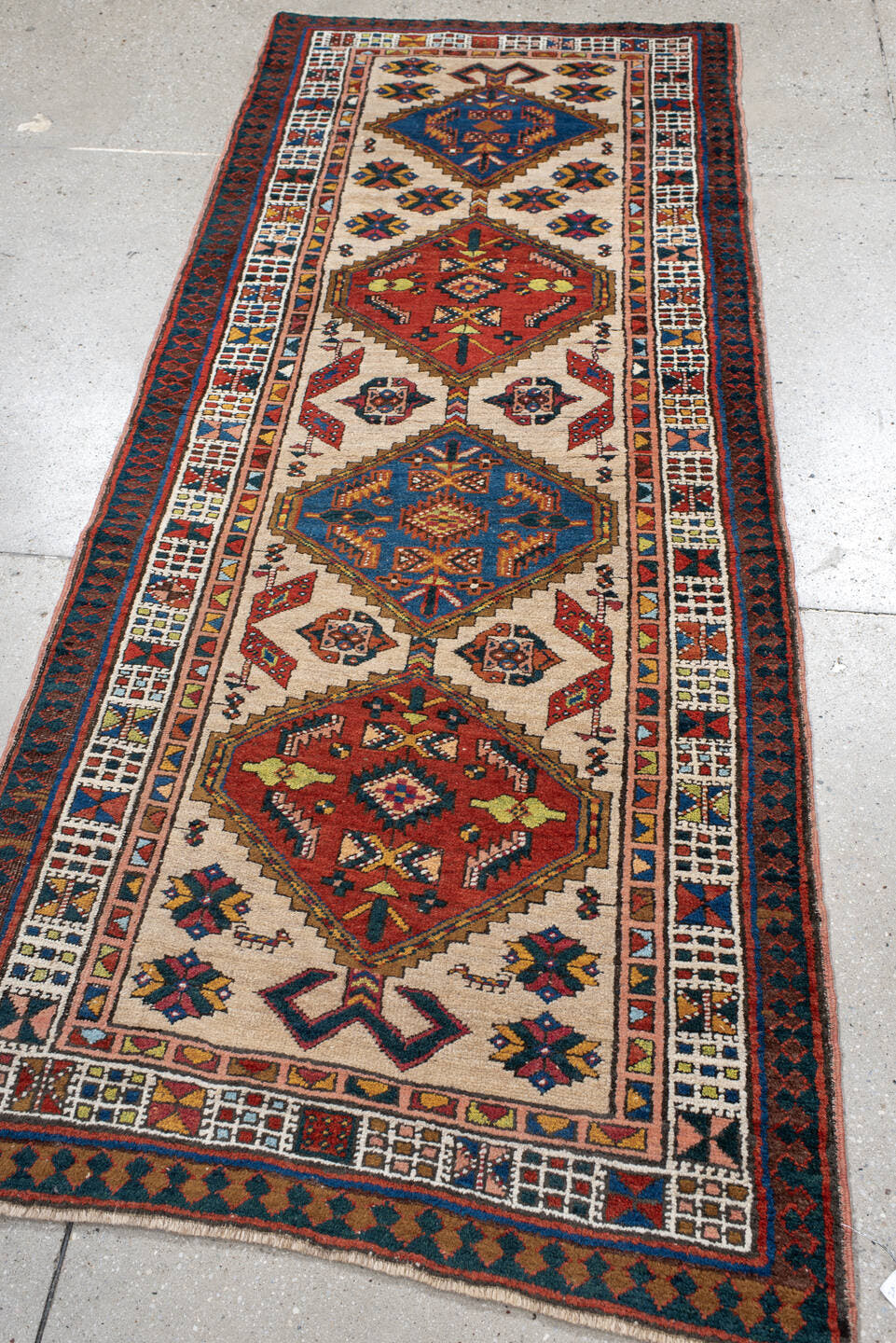 3' x 7' one-of-a-kind handmade antique Sarab runner rug. Color palette: ivory, indigo, rust, camel, navy, coral, gold, sage