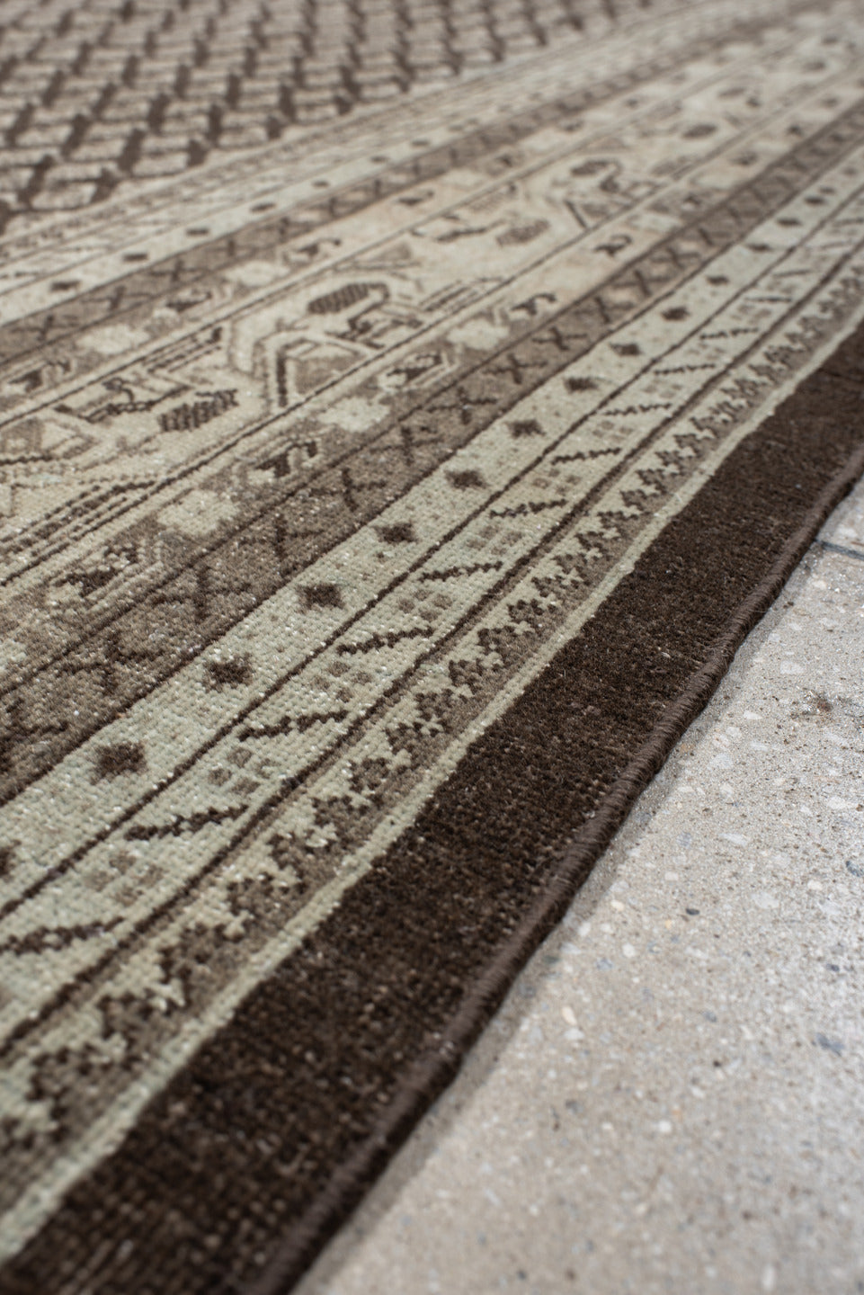 7' x 10' one-of-a-kind handmade vintage Mir large size rug. Color palette: black, brown, gray, light gray, off-white, pink