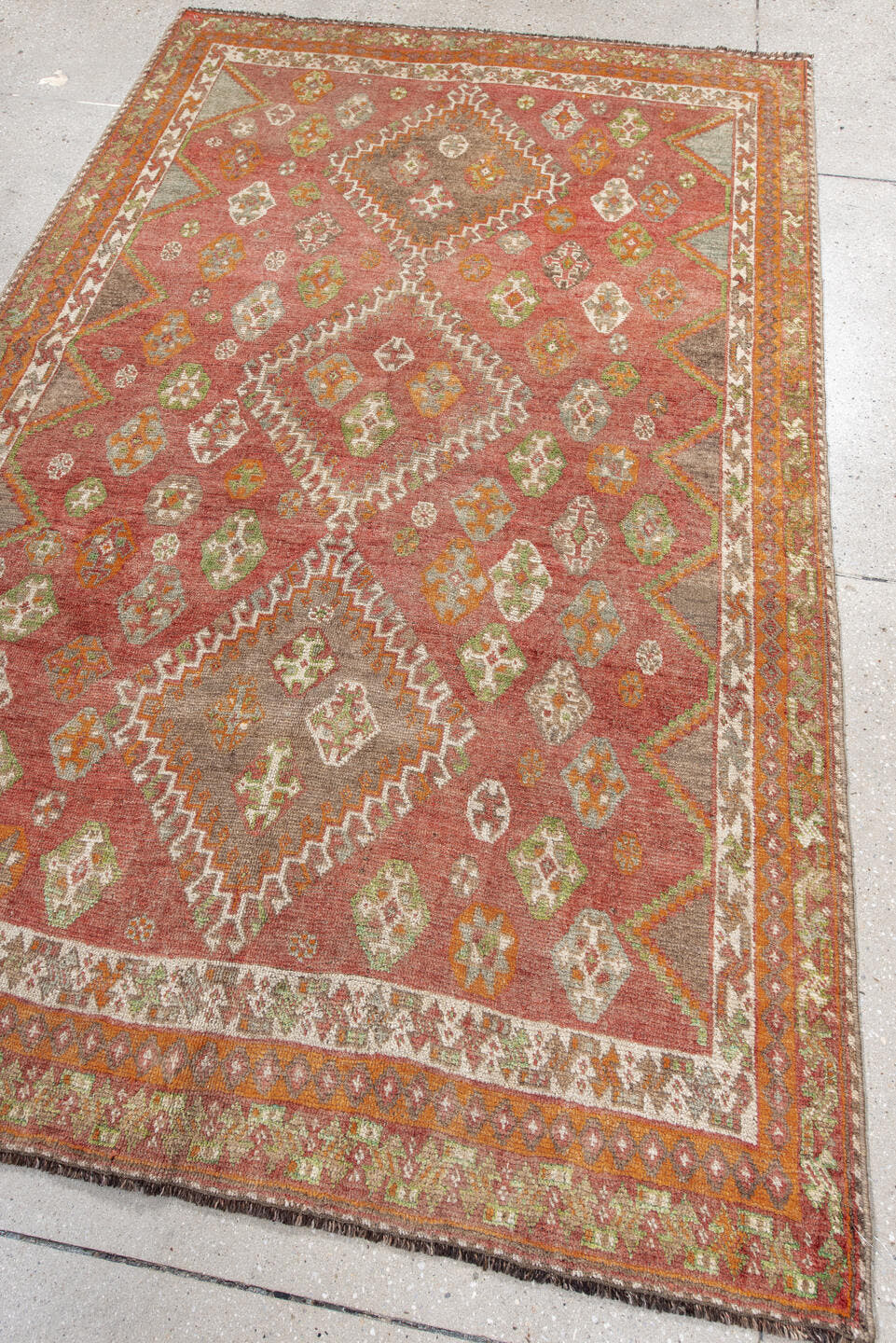 4' x 7' one-of-a-kind handmade antique Gabbe rug. Color palette: terra cotta, ivory, orange, sage, gray, taupe, rust