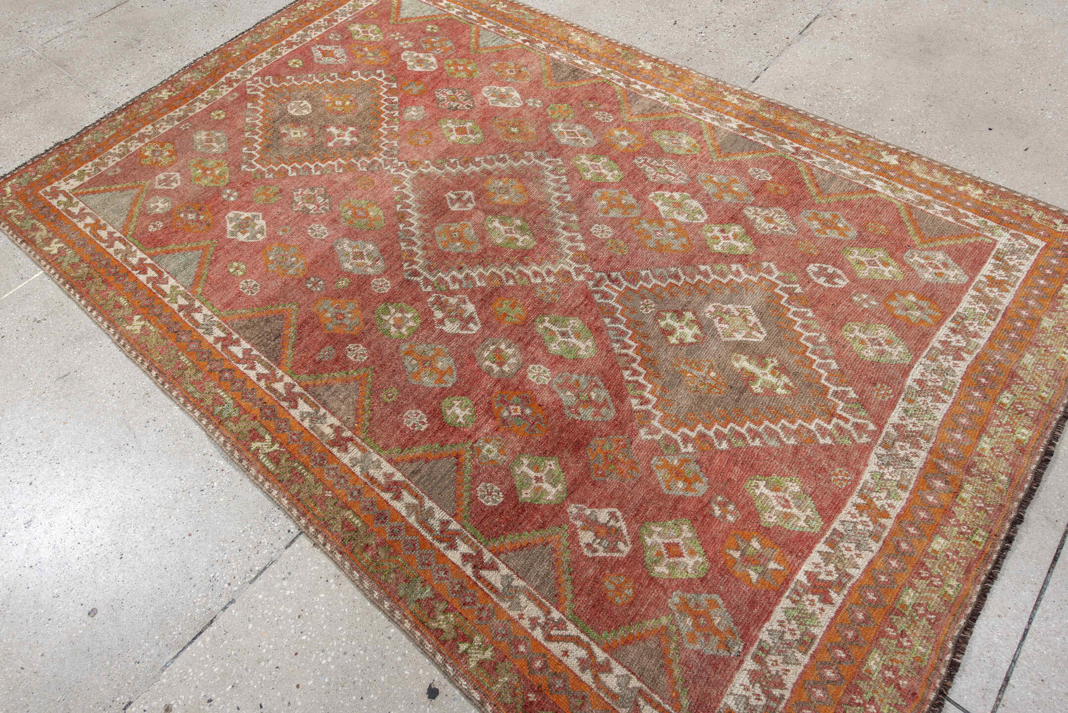 4' x 7' one-of-a-kind handmade vintage Gabbe rug. Color palette: brown, gray, light gray, off-white, orange, pink