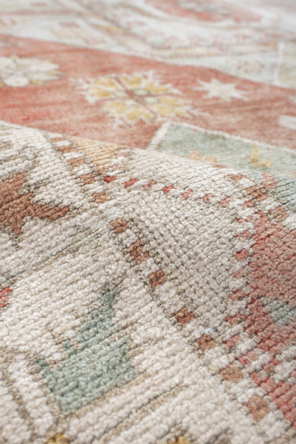 6' x 9' one-of-a-kind handmade antique Anatolian medium size rug. Color palette: ivory, coral, sage, pale_blue, taupe, gold
