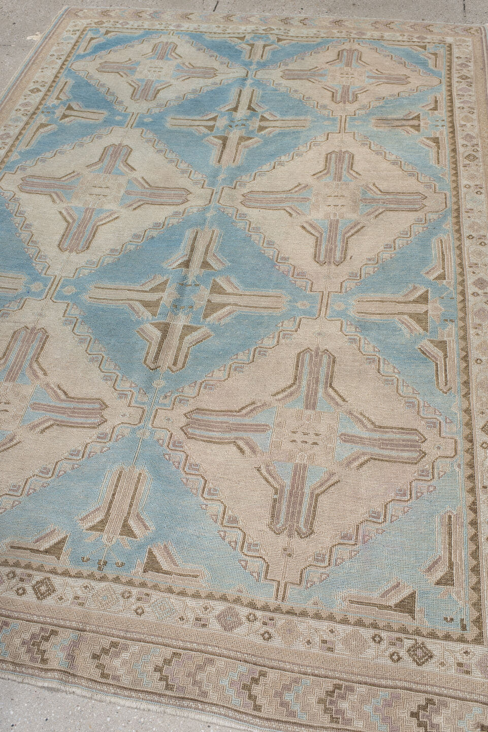 5' x 7' one-of-a-kind handmade antique Sumak rug. Color palette: ivory, light blue, taupe, beige, camel, gray