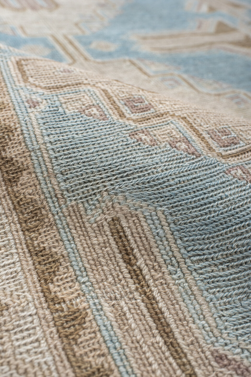 5' x 7' one-of-a-kind handmade antique Sumak rug. Color palette: ivory, light blue, taupe, beige, camel, gray