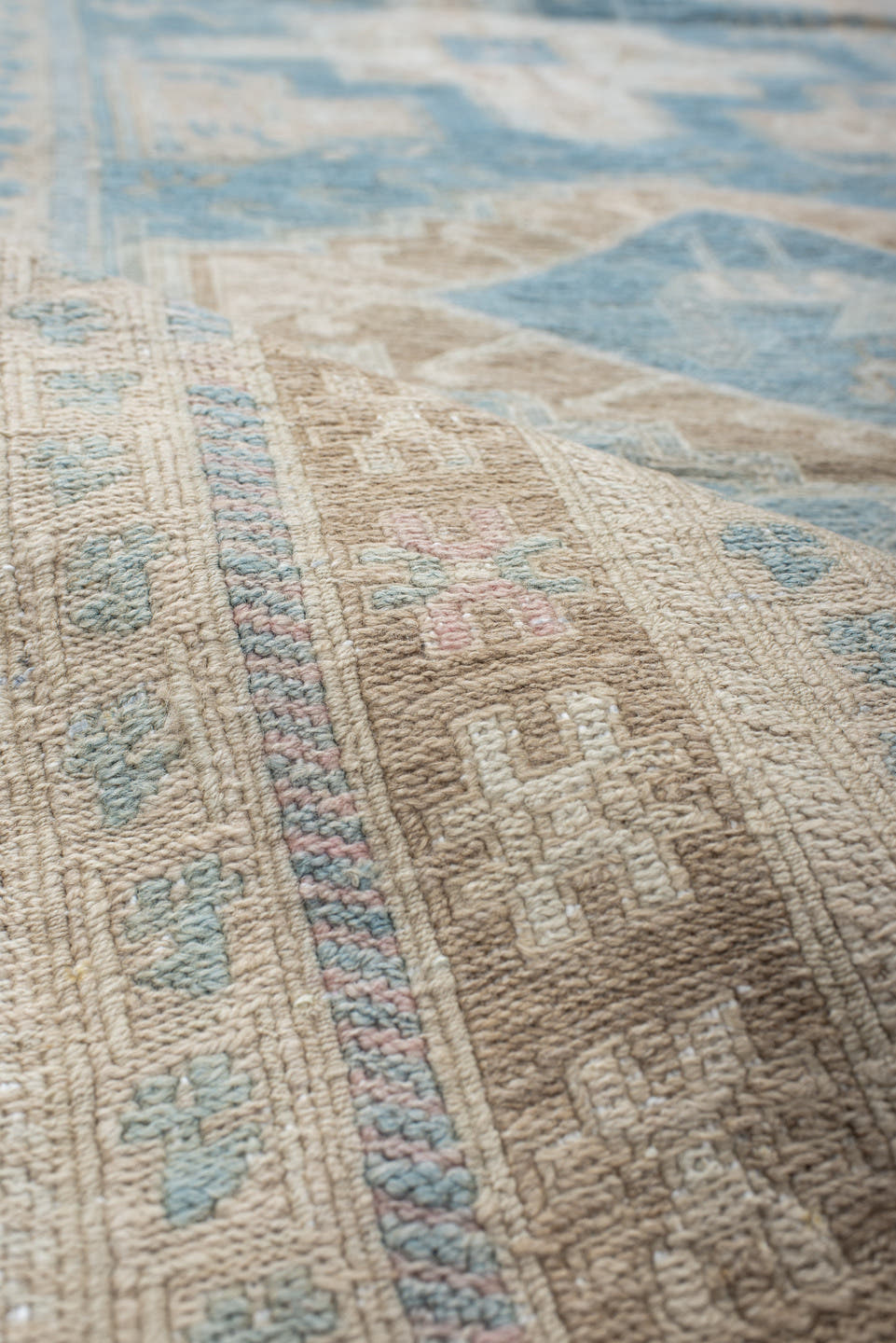 3' x 9' one-of-a-kind handmade vintage Sumak runner rug. Color palette: powder blue, ivory, taupe, beige, sand, pale brown