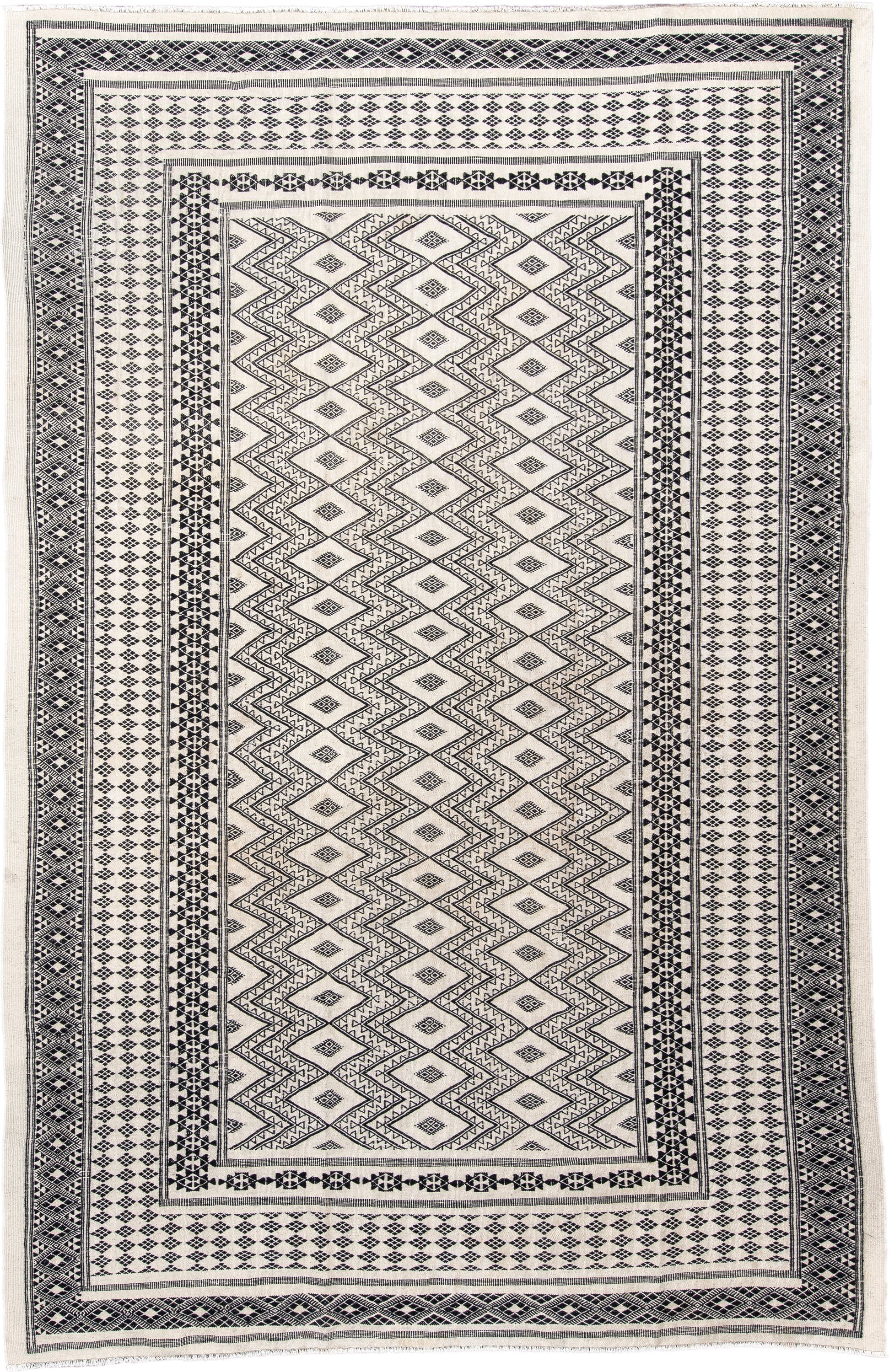7' x 10' one-of-a-kind handmade vintage Kilim large size rug. Color palette: ivory, charcoal, black, gray