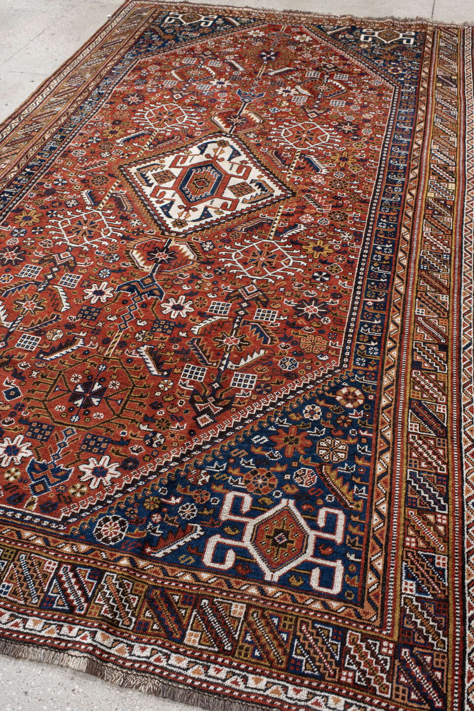6' x 11' one-of-a-kind handmade antique Qashqai large size rug. Color palette: rust, navy, ivory, terracotta, camel