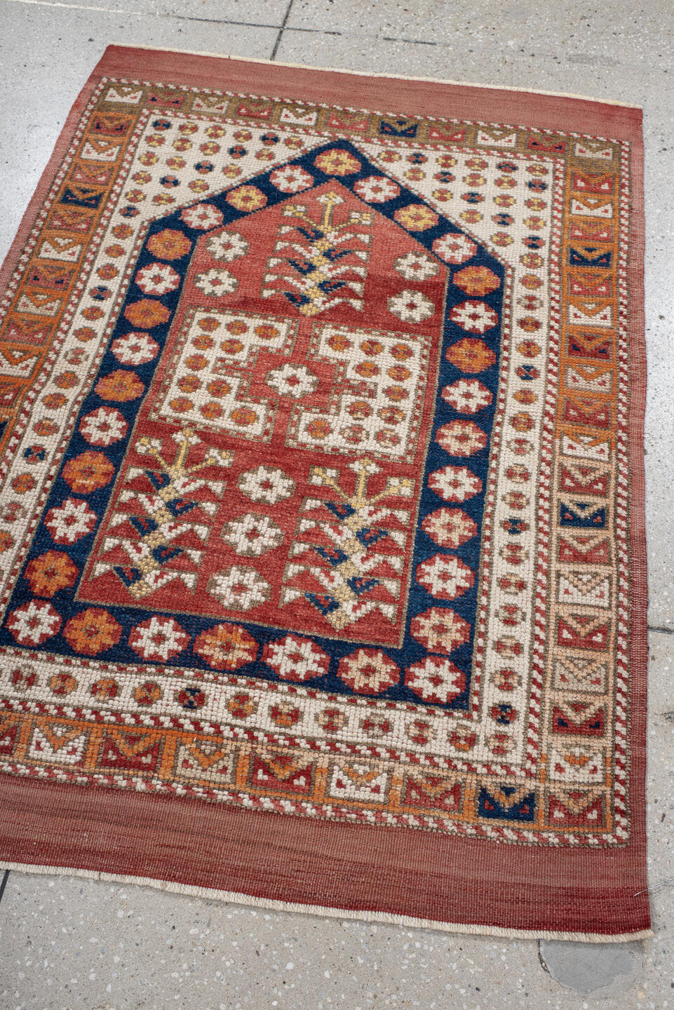 3' x 4' one-of-a-kind handmade antique Anatolian small size rug. Color palette: terracotta, ivory, indigo, rust, gold, camel