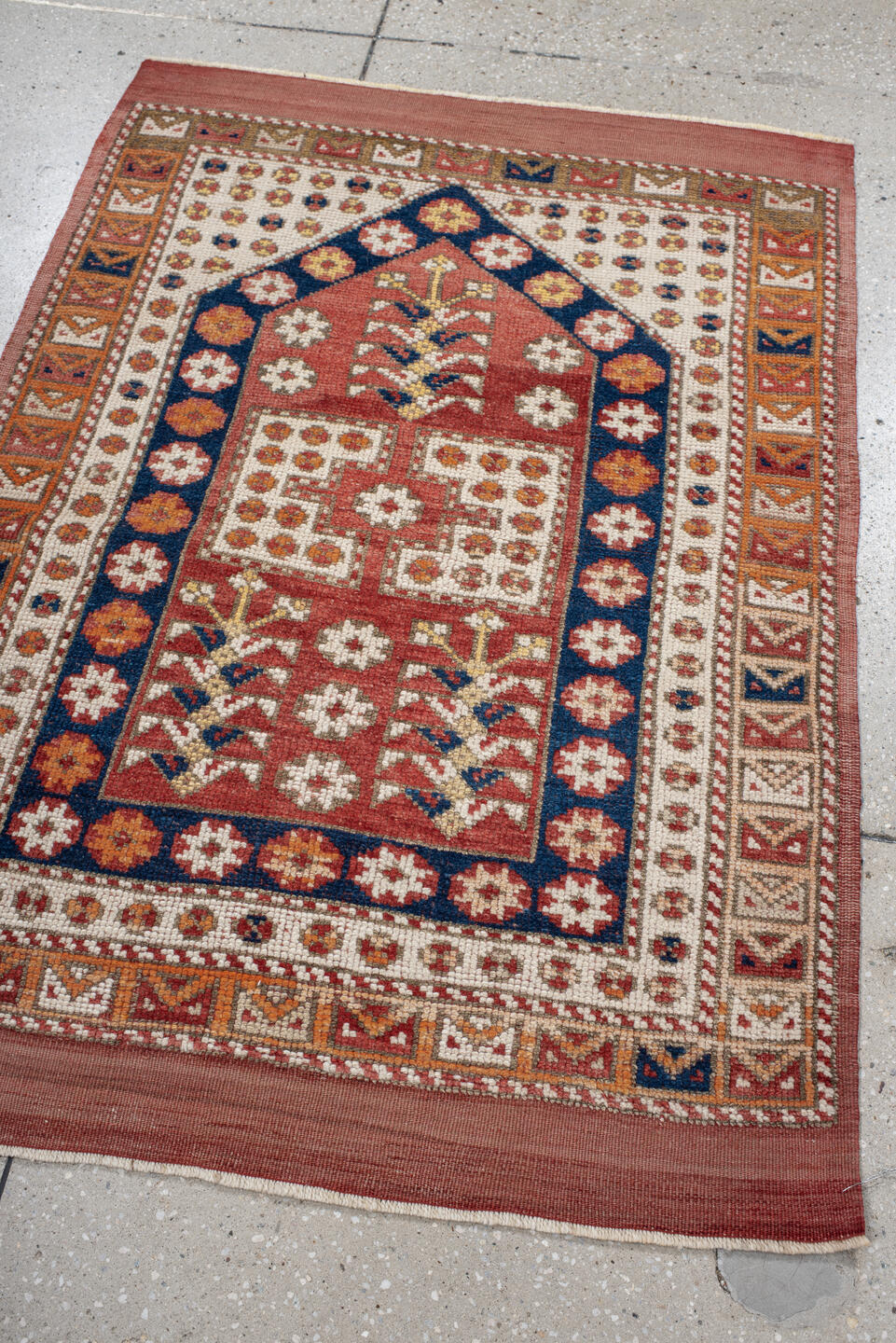 3' x 4' one-of-a-kind handmade antique Anatolian small size rug. Color palette: terracotta, ivory, indigo, rust, gold, camel