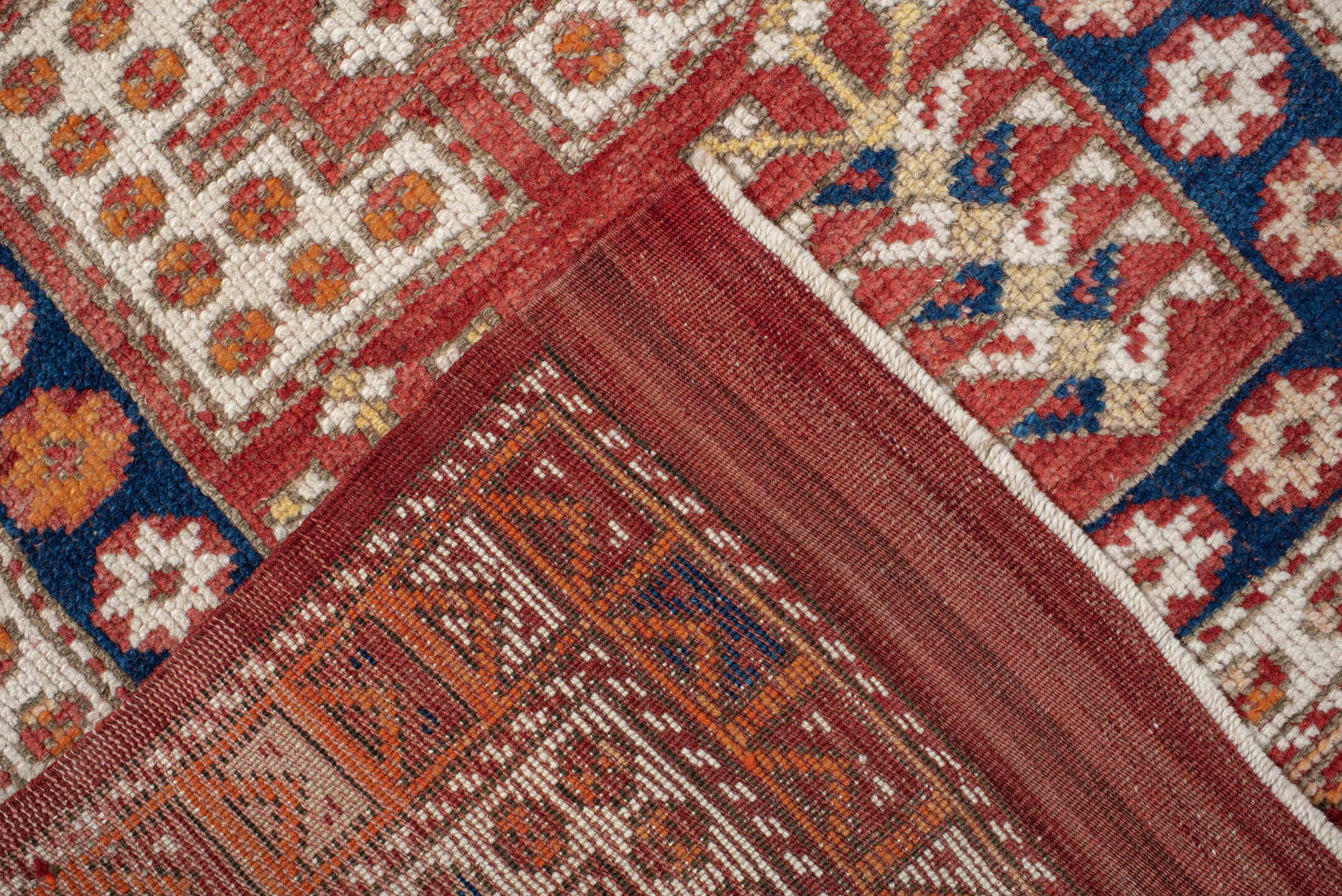 3' x 4' one-of-a-kind handmade antique Anatolian small size rug. Color palette: terracotta, ivory, indigo, rust, gold, camel