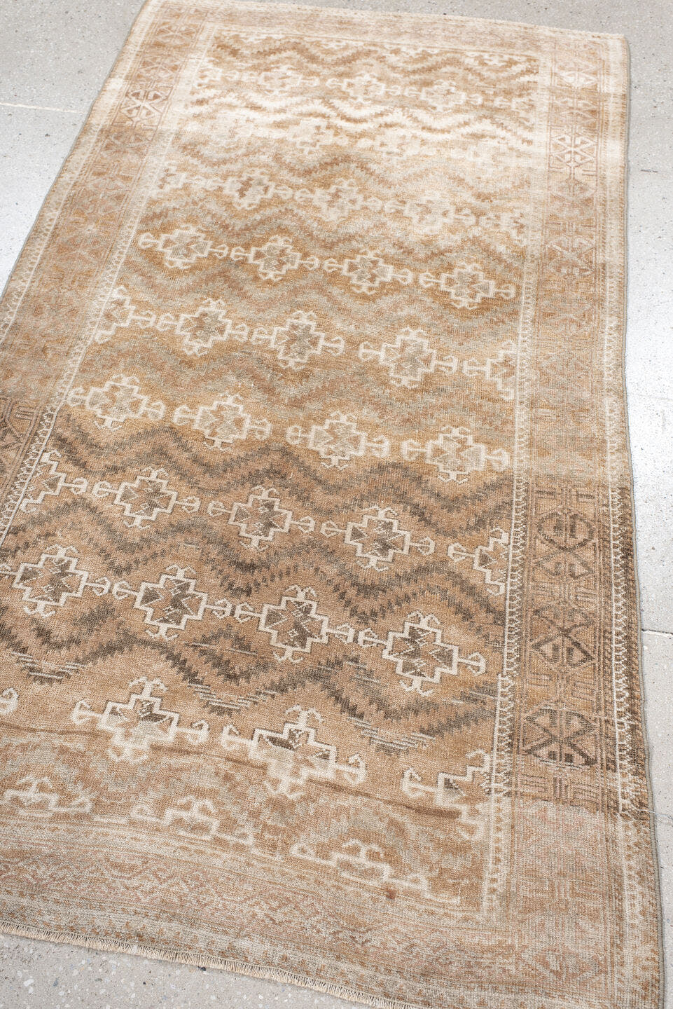3' x 6' one-of-a-kind handmade antique Belouch small size rug. Color palette: camel, ivory, taupe, brown, sand, beige, gray