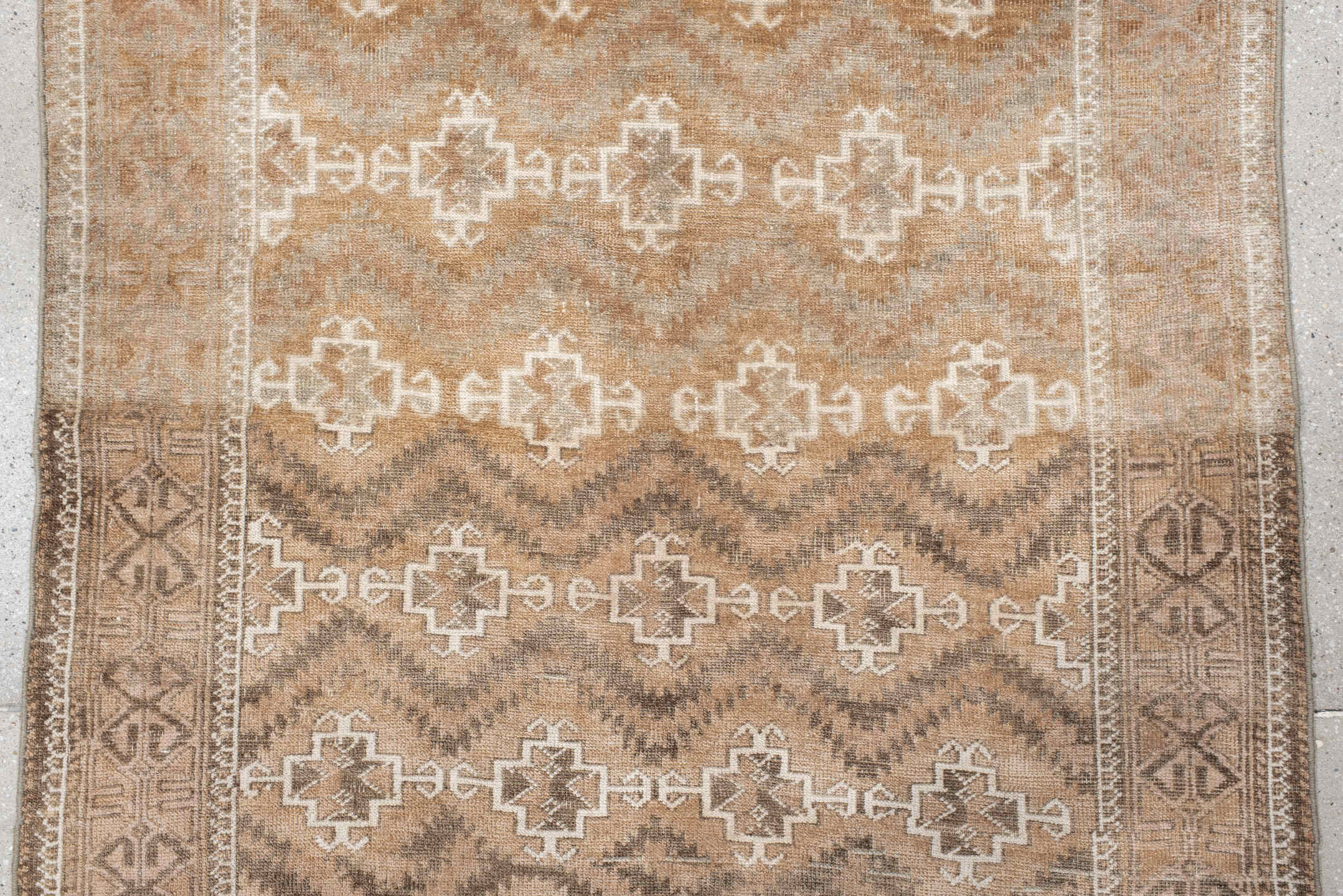 3' x 6' one-of-a-kind handmade antique Belouch small size rug. Color palette: camel, ivory, taupe, brown, sand, beige, gray