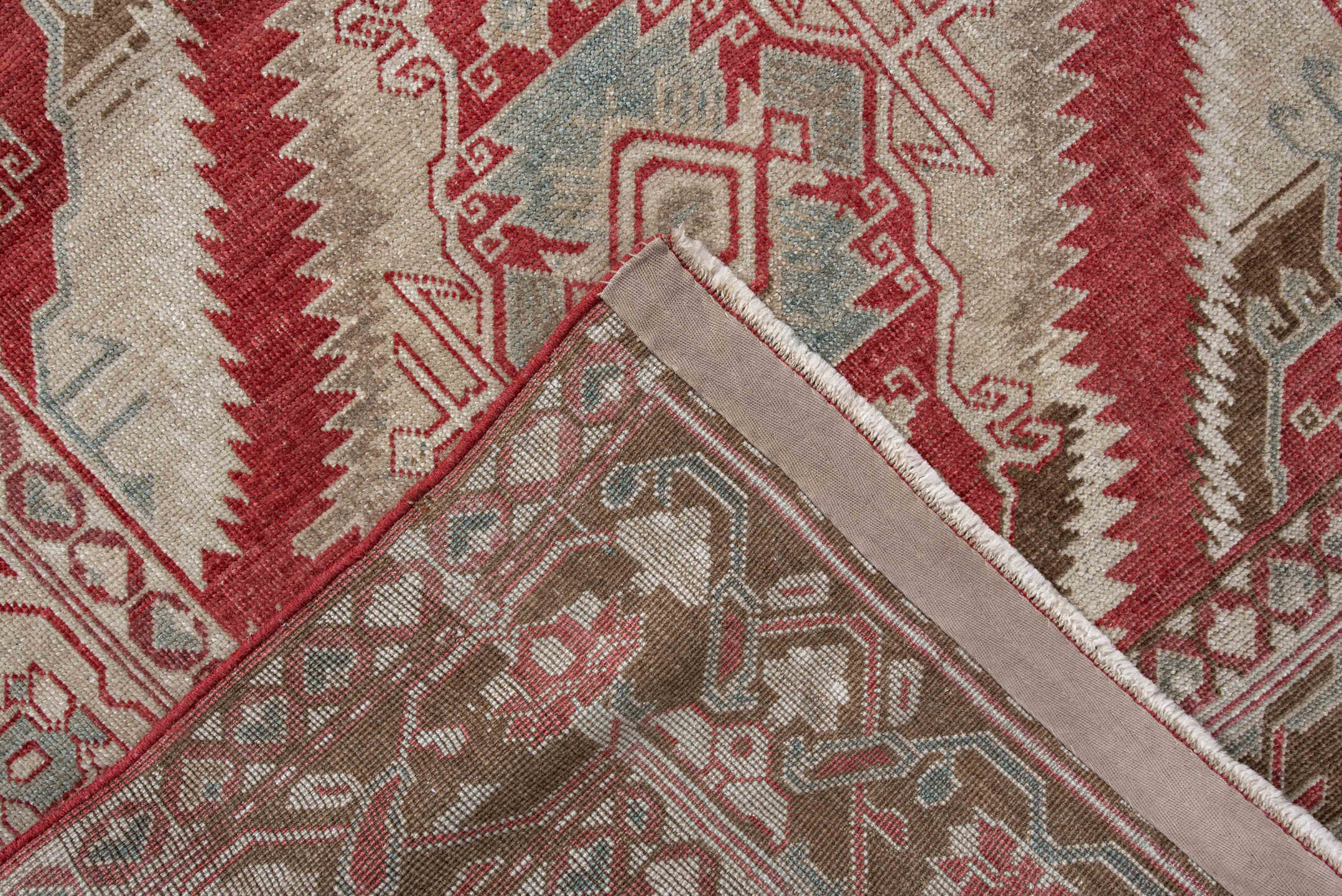 3' x 5' one-of-a-kind handmade antique Caucasian small size rug. Color palette: ivory, brick red, taupe, pale blue, camel